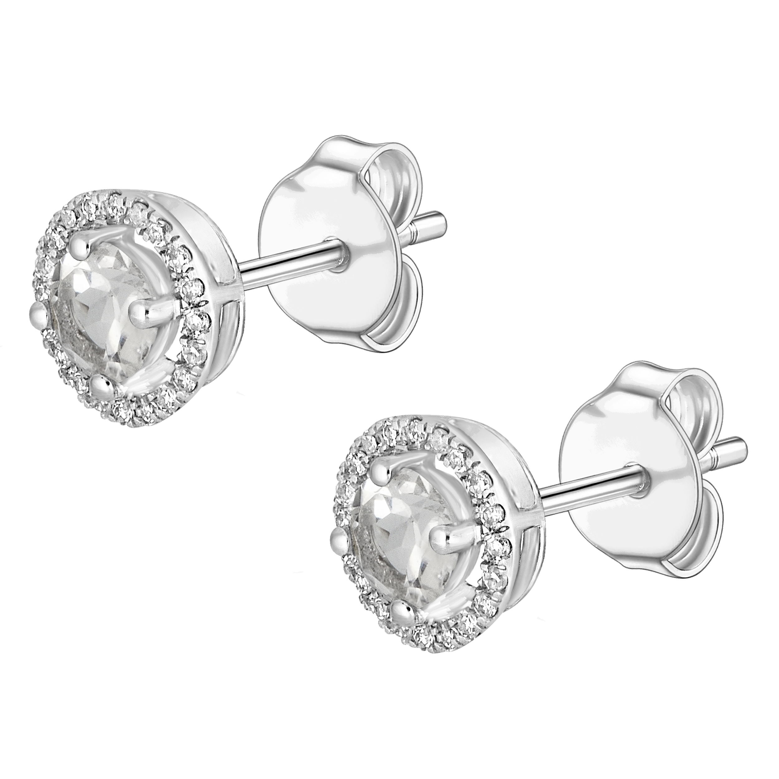 Elegant and radiant, these 14K White Gold Diamond and White Topaz 4mm Round Earrings combine the best of both sparkle and sophistication. Each earring features a 4mm round white topaz, known for its brilliant clarity and shimmering sparkle, beautifully complemented by a delicate diamond accent.Key Features:- 4mm round white topaz- Accented with diamonds- Set in 14K white gold- Secure backings for comfortPlease Note:- Gemstones may be treated to enhance beauty and require special care.- Photos may be enlarged or enhanced for detail.- Carat weights are approximate, with a possible variance of 0.05 carats. 14K WHITE GOLD DIAMOND AND WHITE TOPAZ EARRING