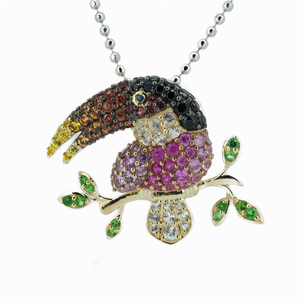 Closeup photo of 14K YELLOW GOLD TSAVORITE, BLACK SPINEL AND MULTICOLOR SAPPHIRE TOUCAN PENDANT WITH CHAIN