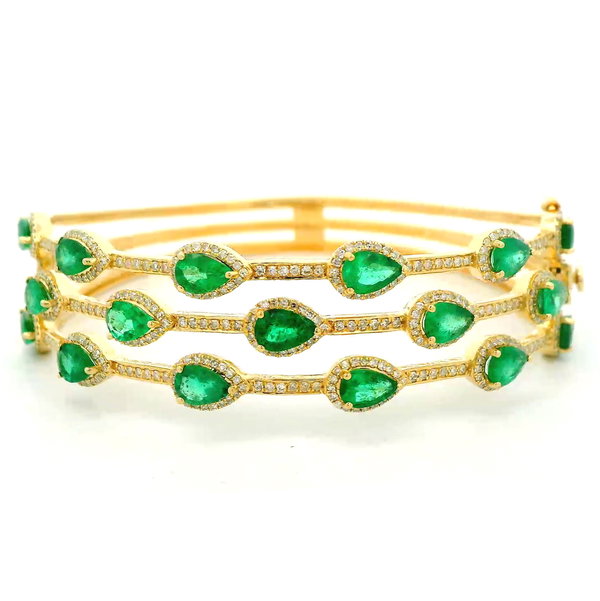 Closeup photo of 14K YELLOW GOLD DIAMOND AND EMERALD BANGLE