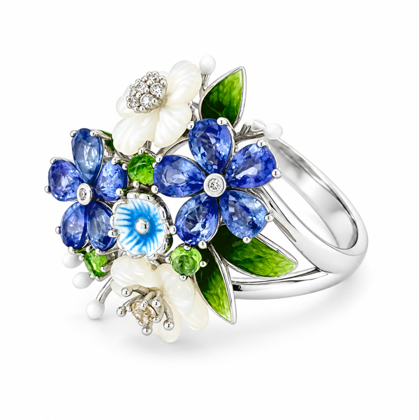 Closeup photo of 14K WHITE GOLD DIAMOND, TSAVORITE, WHITE SAPPHIRE, SAPPHIRE AND WHITE MOTHER OF PEARL FLOWER ENAMEL RING