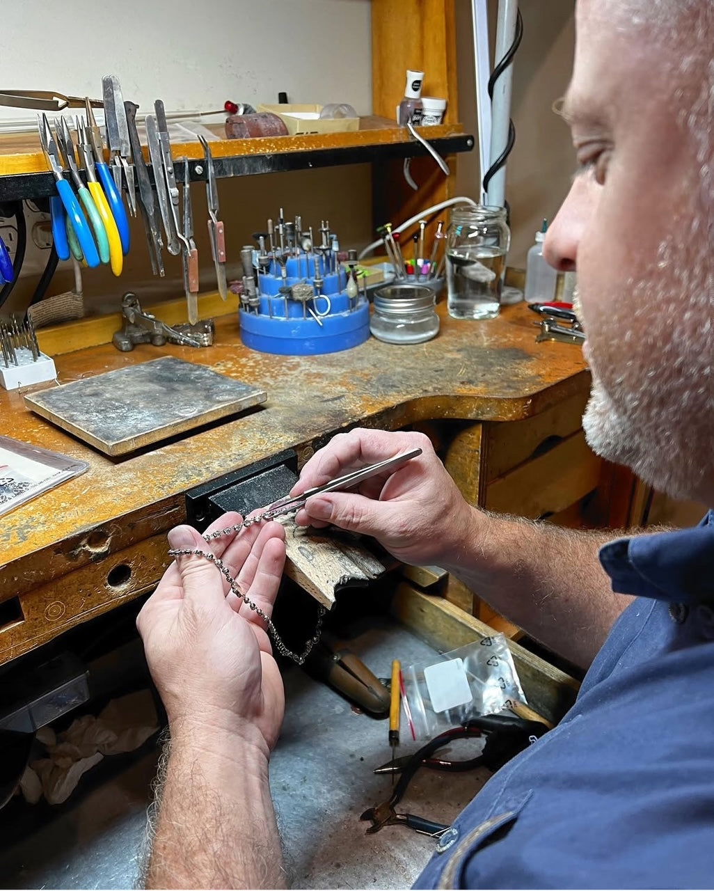 A Magnolia City Jewelers jeweler at the bench