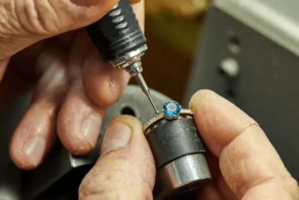 Jeweler inspecting a finished piece under magnification