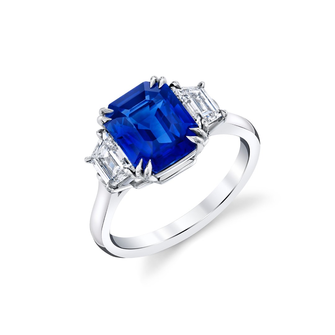 3.53 ct Emerald Cut Blue Sapphire-Ceylon set in Platinum with 2 Trapezoid F/G, VS1 Diamonds ring