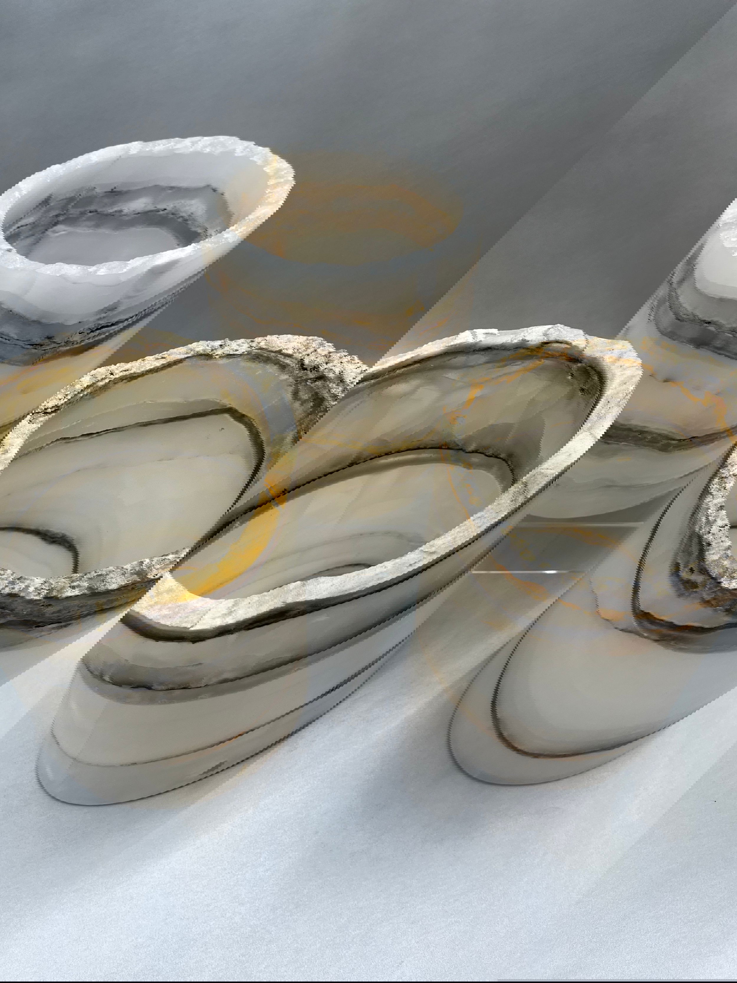 Enhance your decor with an Onyx Polished Hurricane. Crafted from premium grade Onyx, it is sure to add an element of sophistication and luxury to any interior setting. With its natural colors and ethereal lines, these hurricanes light up beautifully with a candle creating perfect ambiance. (Product may vary)Height: 7" to 8", Width: 6", Weight: 7.5lbs (measurements vary) Onyx Rustic Polished Hurricane