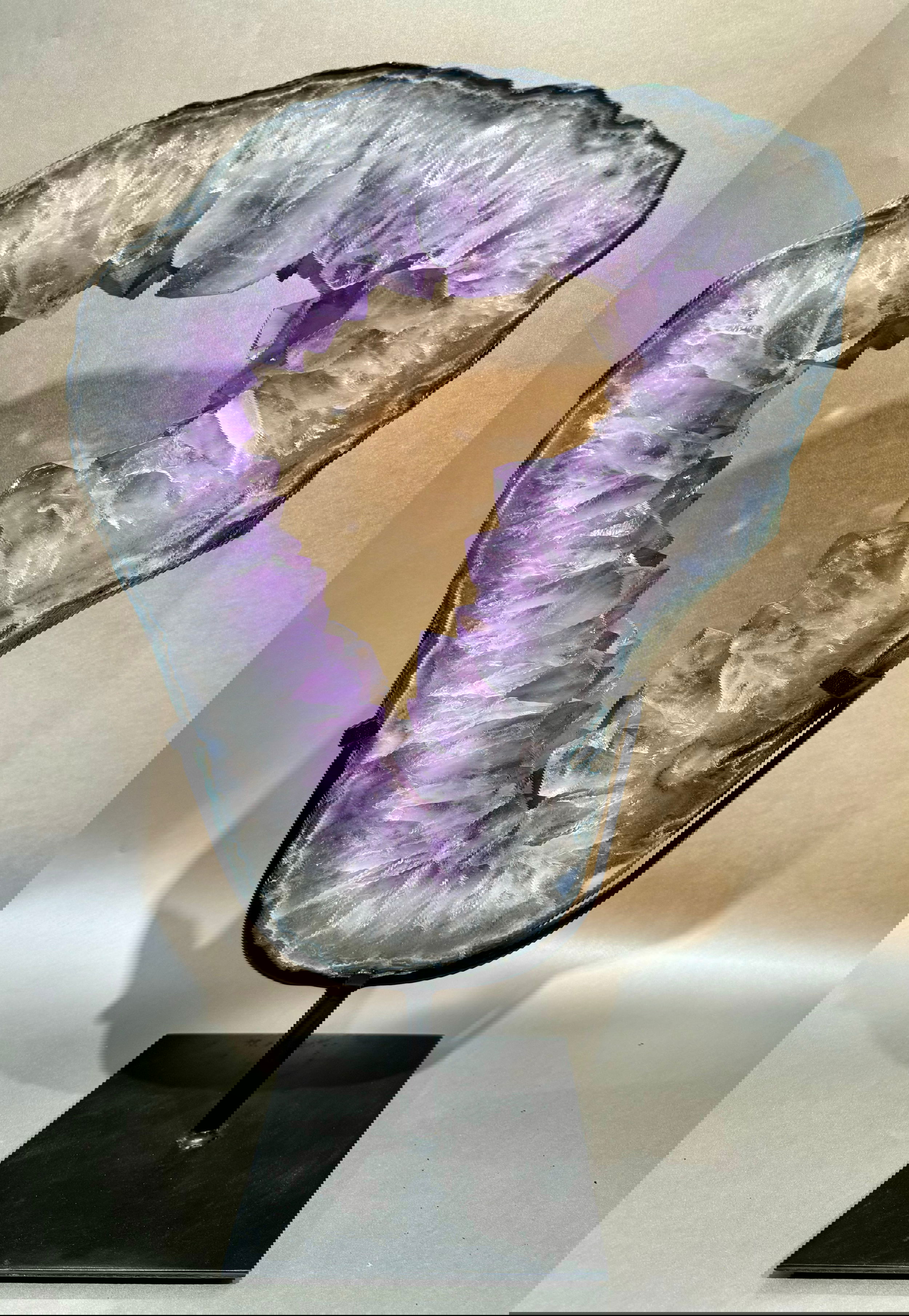 Glimmering Large Amethyst Geode Rings mounted to a custom stand, exquisitely crafted to make an unforgettable statement of luxury and style.Approx. 22" x 13" Large Amethyst Geode Ring on stand