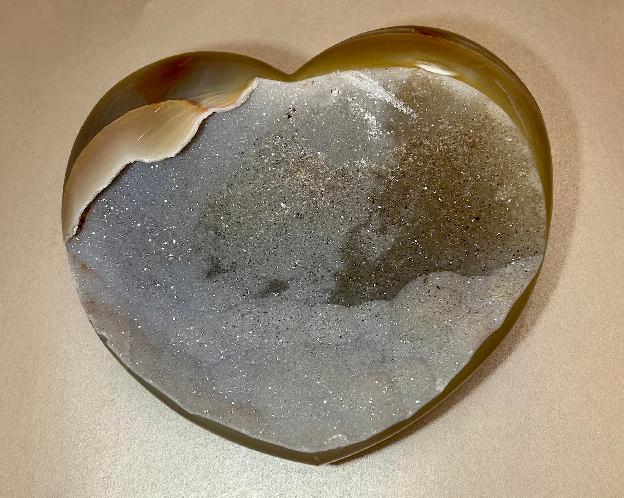 This "extra extra" large sized Druze crystal is a beautiful gemstone, with the unique shape of a heart. The Druze variety usually has a distinct crystalline surface with tiny sparkling crystals embedded within. This is a lovely little mineral that would make a wonderful gift or addition to your personal collection. Druse Heart- Extra Extra Large
