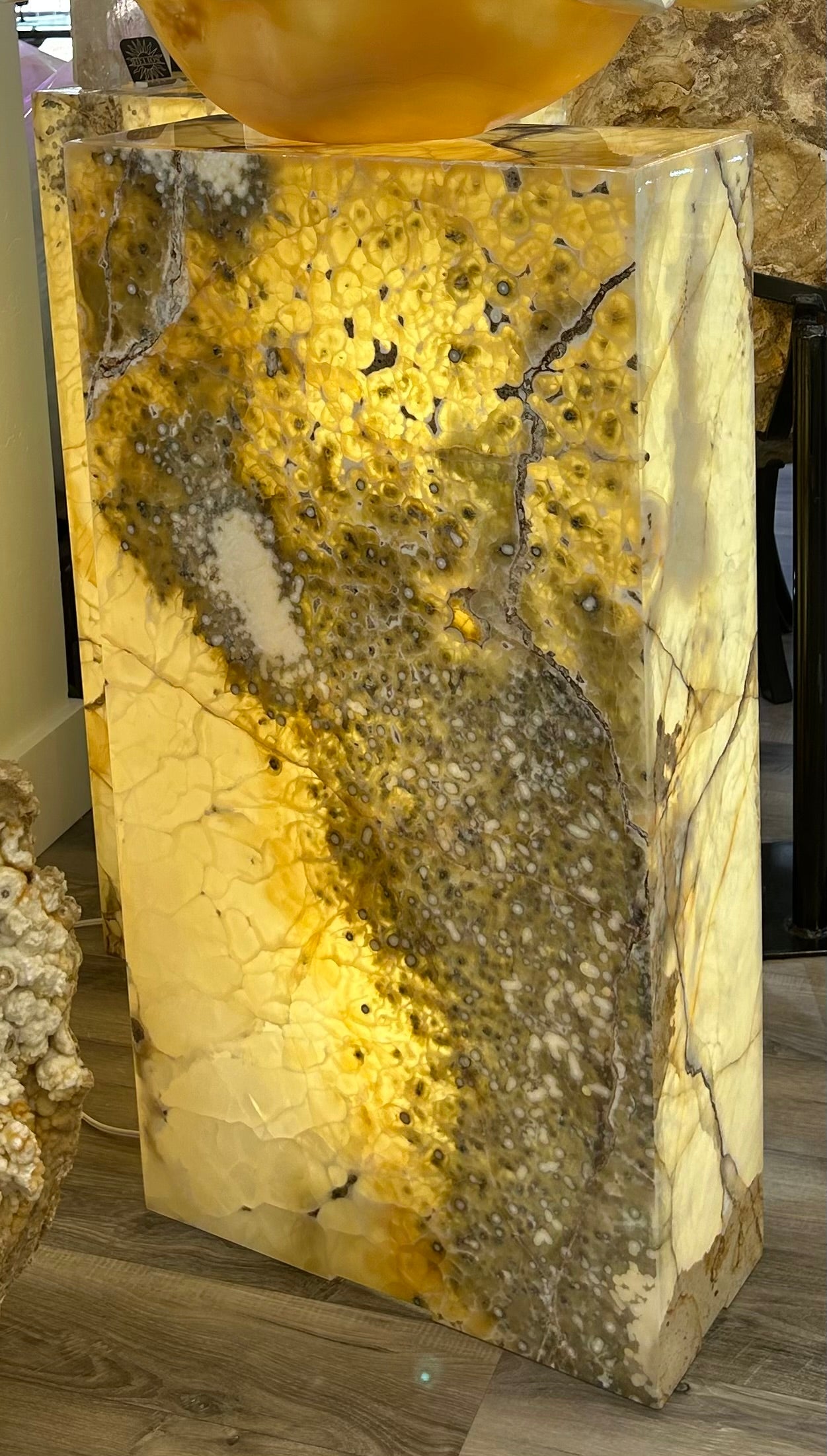 Indulge in the luxuriously crafted Rectangular Illuminated Onyx Beehive lamp. With its unique "beehive" pattern and opulent onyx material, this rectangular lamp adds a touch of sophistication and exclusivity to any room. Illuminate your space with this elegant piece of art, reminiscent of the world of high fashion.Measures approx. 19 3/4"W x 8"D x 36 1/2"H each. Rectangular Illuminated Onyx Beehive