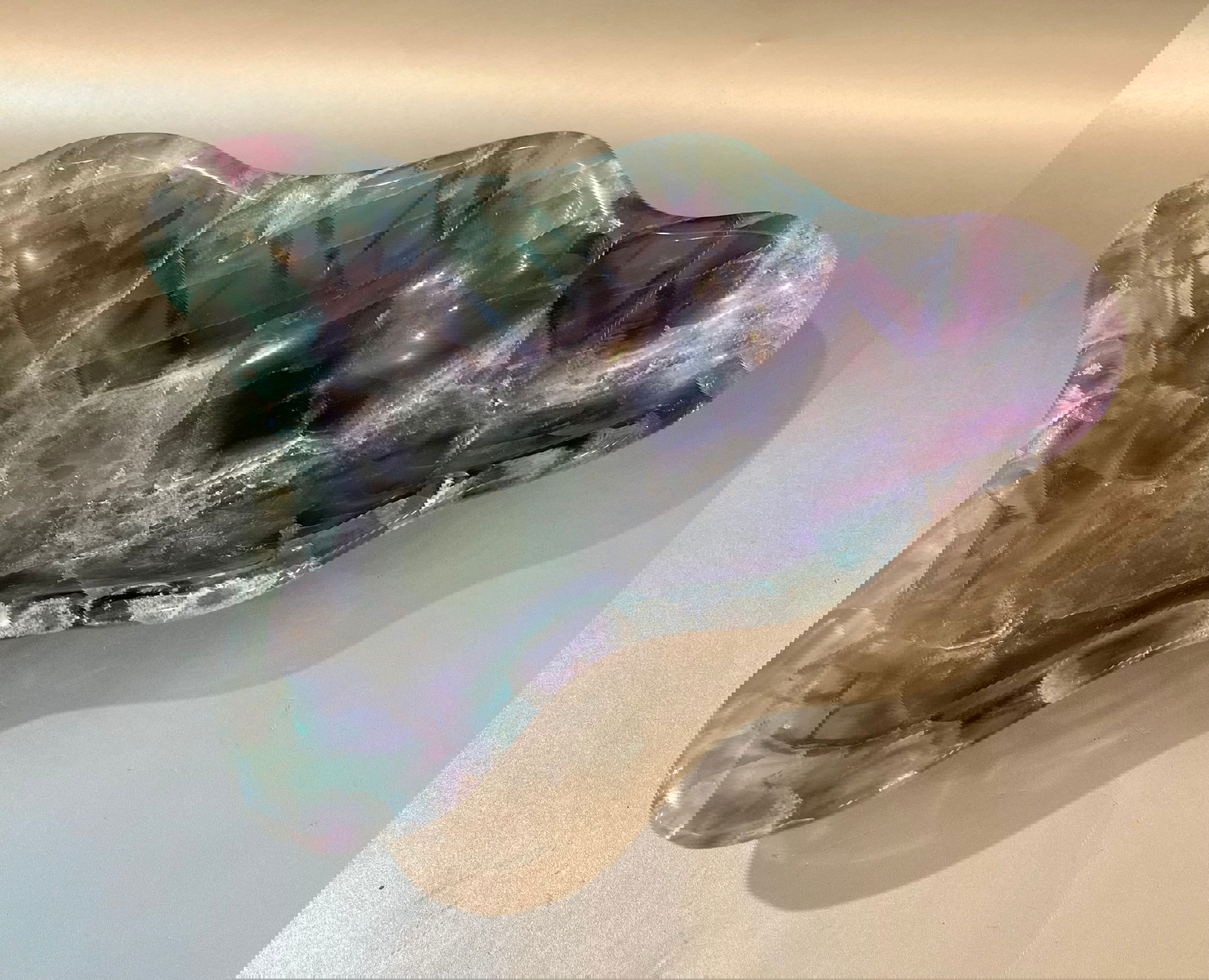Indulge in luxury with our Banded Fluorite Bowl. Crafted from rare, high-vibration Fluorite, this bowl is more than just a decorative piece - it brings a sense of elegance and refinement to any space. Allow its energy to elevate your surroundings and enhance your days.Approx. 8 x 5 x 2 Banded Fluorite Bowl