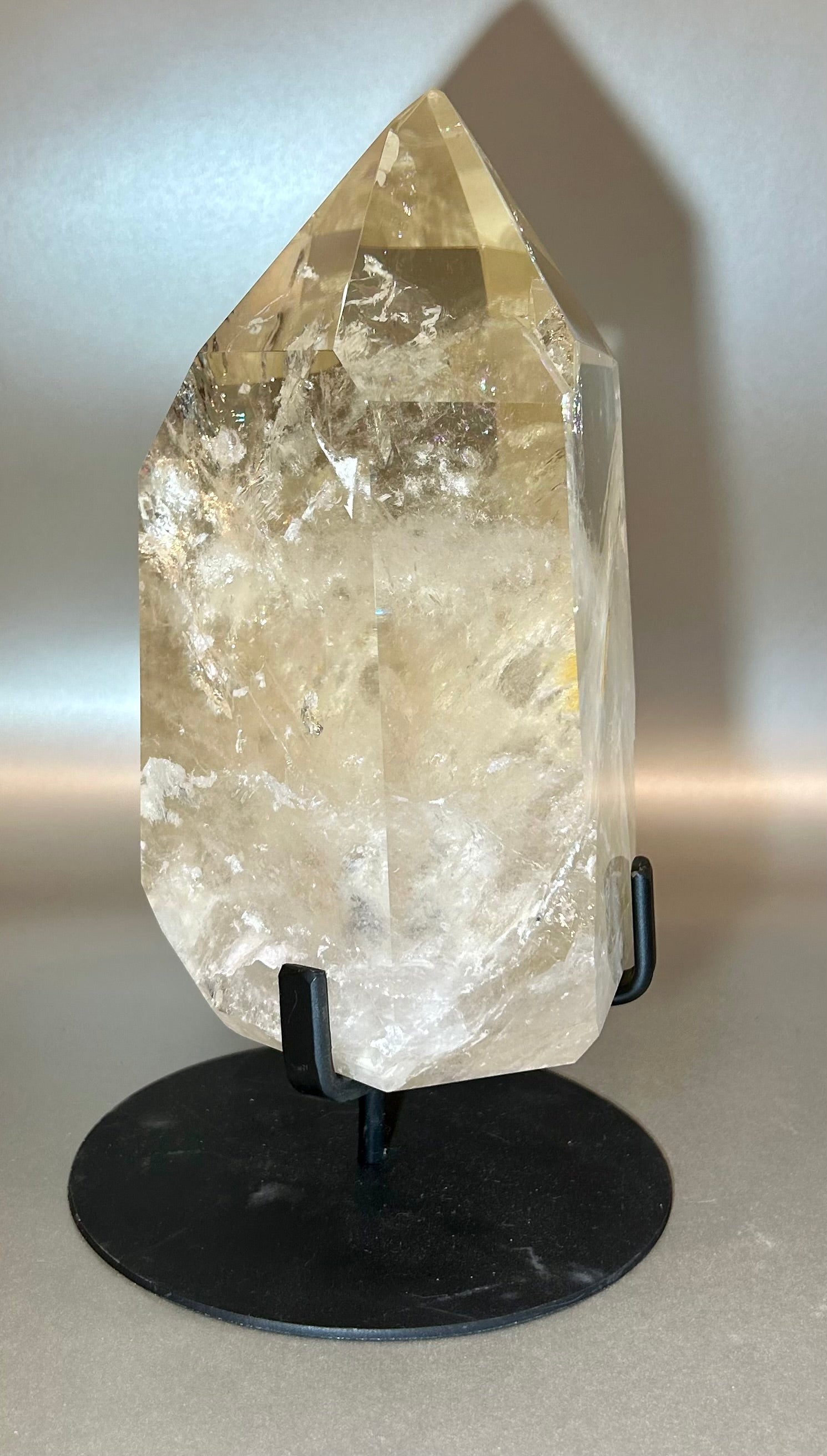 Indulge in luxury with our Large Champagne Citrine Point. This extra large, rare gem will add elegance and uniqueness to any collection. A conversation starter, it is a must-have for those seeking to elevate their style with exclusive pieces.Approx. 5" x 10" Large Champagne Citrine Point