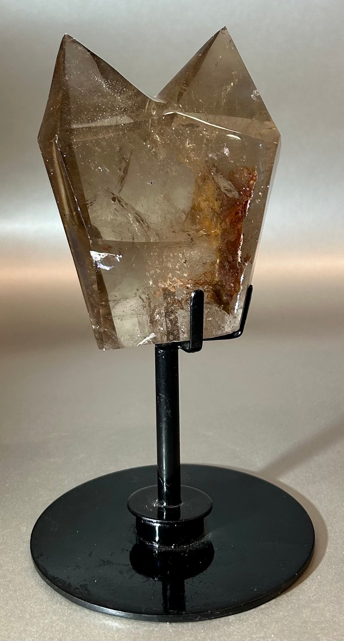 Elevate your space with our exquisite Twin Citrine on stand. Two stunning crystal points delicately balance on a sleek swivel stand, radiating warmth and prosperity. Our premium citrine amplifies abundance and success, making this an ideal addition to your luxurious decor.Measures approx. 4"W x 7"H. Twin Citrine On Stand