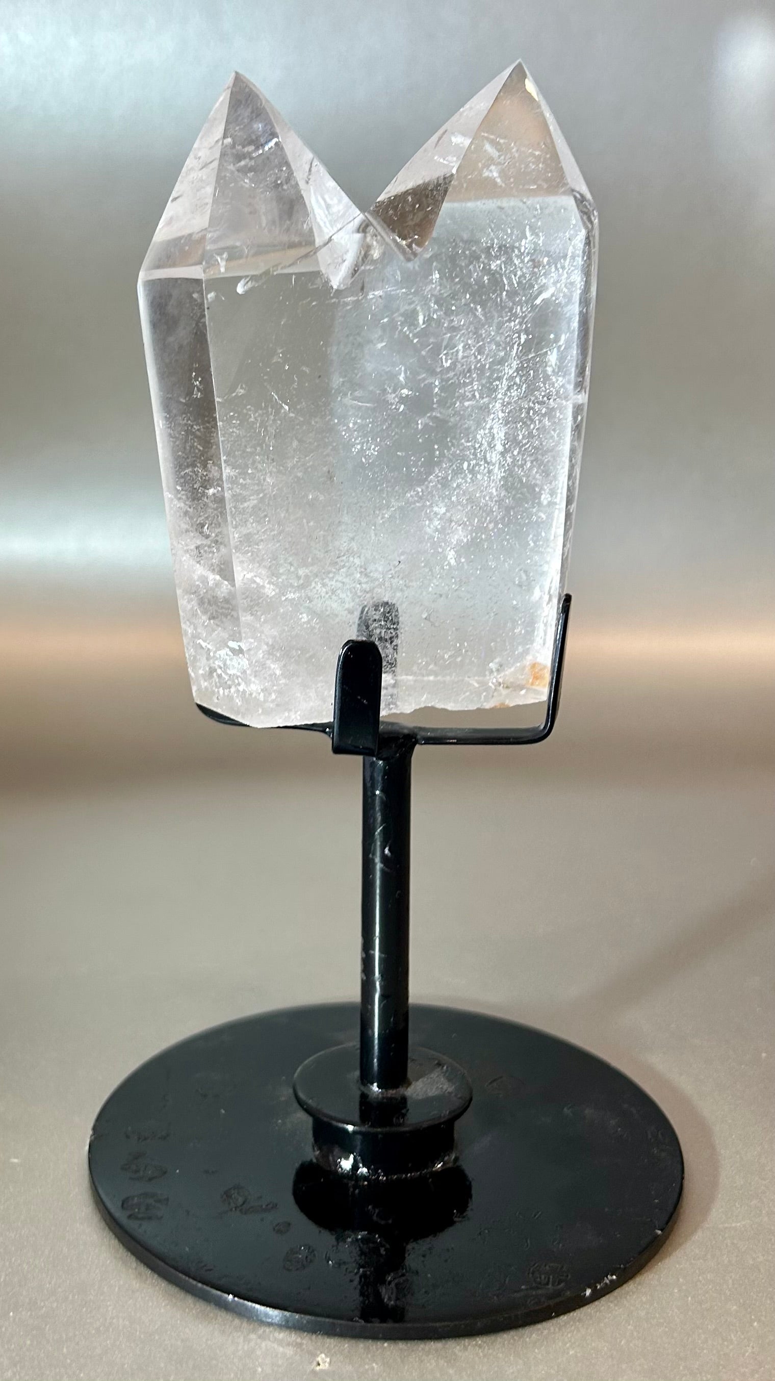 Embrace the essence of elegance with our Twin Crystal On Stand. This luxurious creation features two exquisite twin crystals, delicately placed on a swivel stand, allowing for versatile display options. Add a touch of sophistication to any space with this unique piece that exudes timeless beauty.Measures approx. 4"W x 7"H. Twin Crystal On Stand