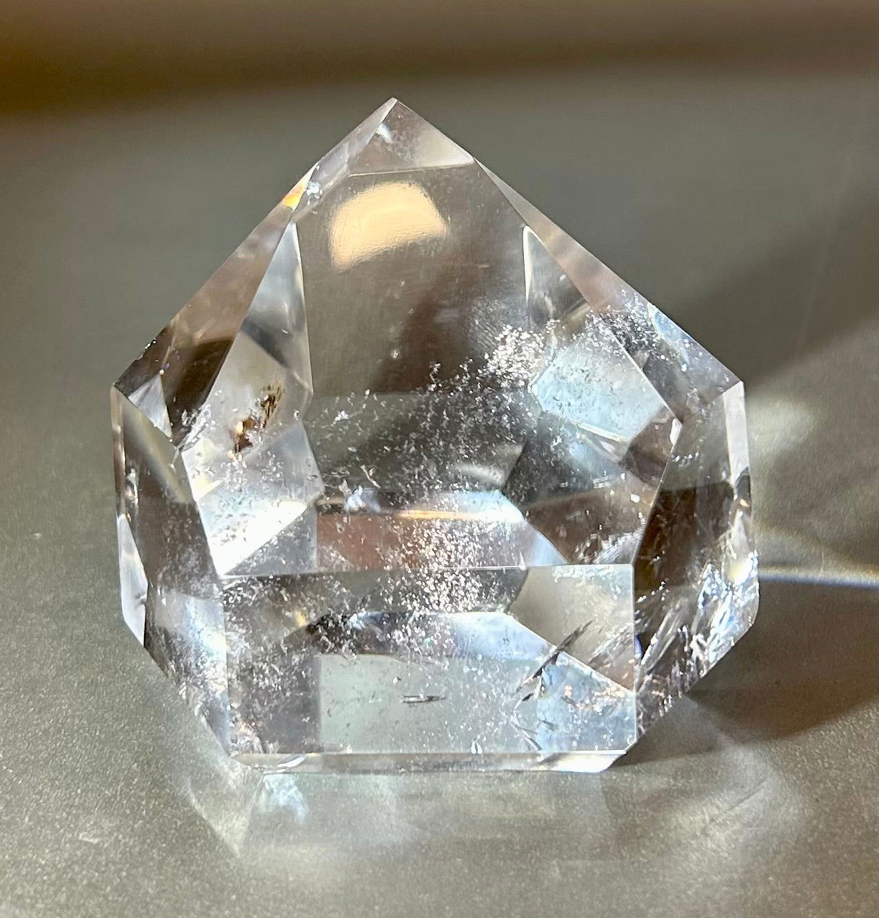 Discover the exquisite beauty of Crystal Point. Crafted from sparkling quartz, this small crystal point will bring a touch of elegance to any setting. Let its energy and clarity inspire your daily life. Experience the luxury of these precious gems.Measures approx. 3"W x 2.75"H. Crystal Point