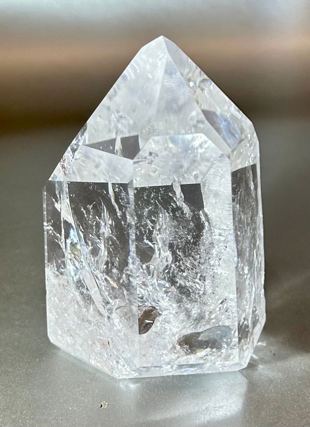 Discover the exquisite beauty of Crystal Point. Crafted from sparkling quartz, this small crystal point will bring a touch of elegance to any setting. Let its energy and clarity inspire your daily life. Experience the luxury of these precious gems.Measures approx. 2.25"W x 2.75"H. Crystal Point