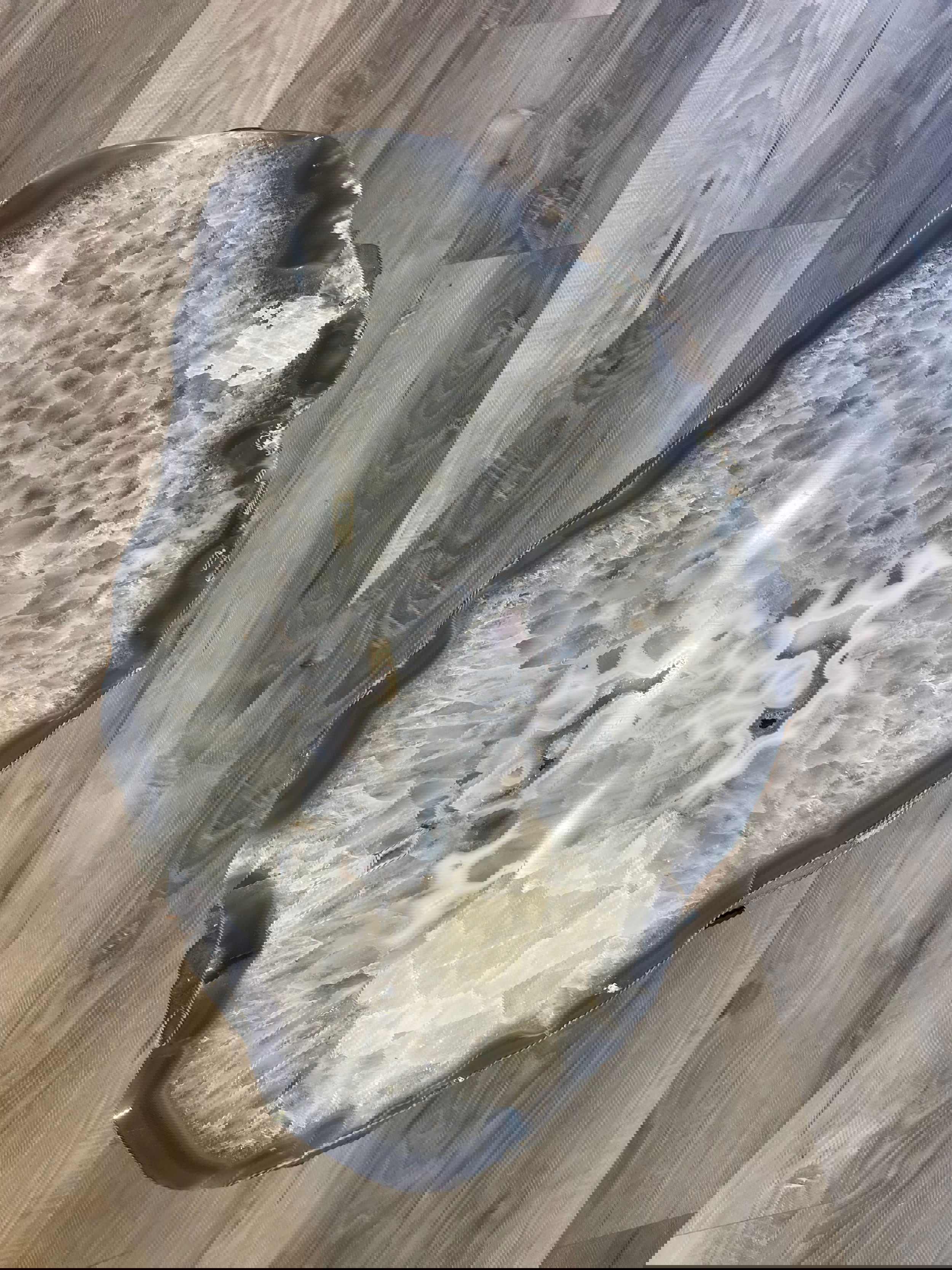 Elevate your living space with this one-of-a-kind agate side table. Handcrafted from genuine agate with a wide variety of stunning inclusions, the unique shapes and patterns add a timeless artistic elegance to any room. Durable and luxurious, it's the perfect statement piece for your home.Approx. 16" T x 23" x 15" Agate Side Table with inclusions