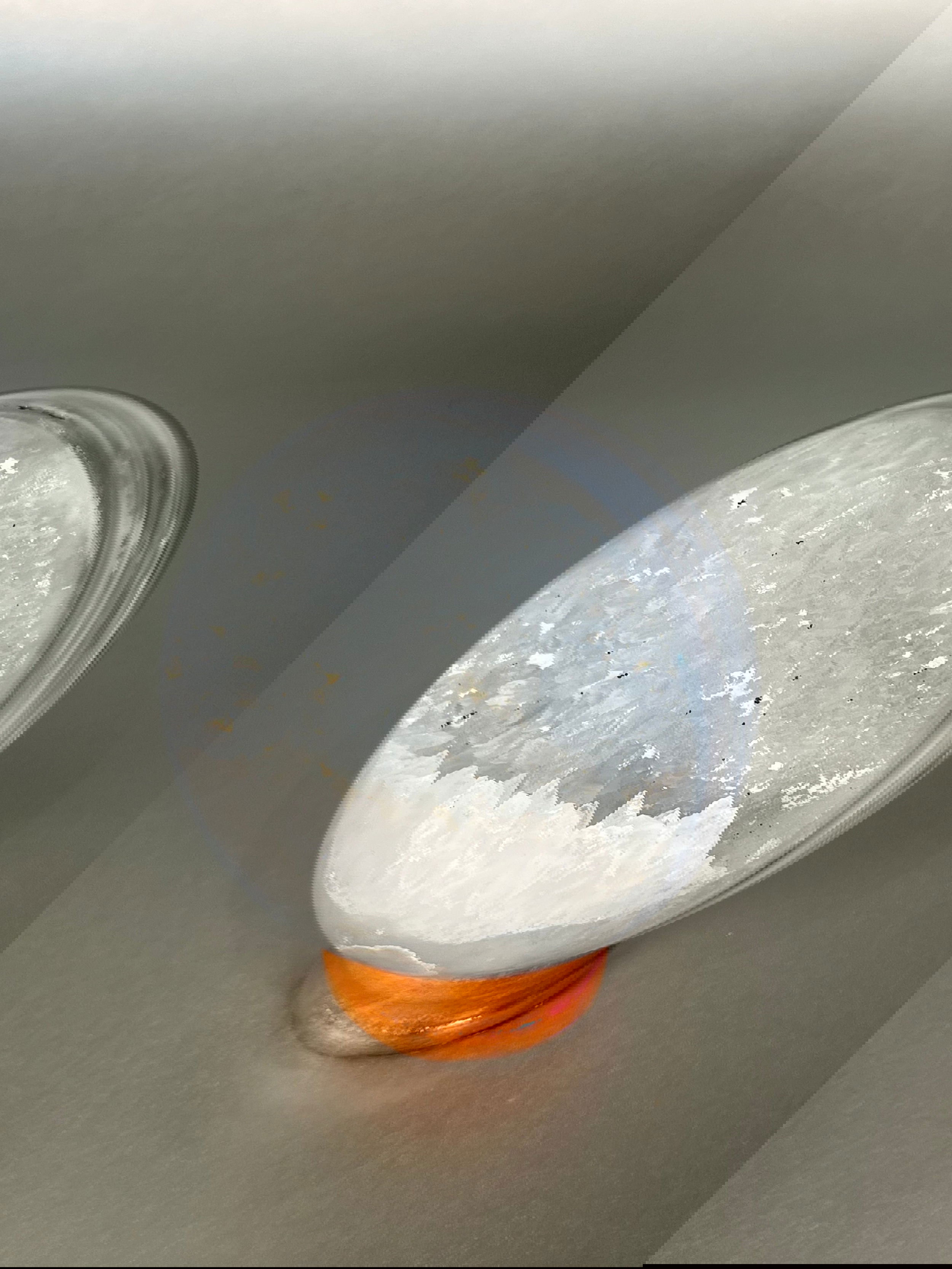 Introducing a true work of art - the Geode Sphere. Each sphere is uniquely crafted from a geode, showcasing its natural beauty in an exquisite, one-of-a-kind piece. The perfect addition to any sophisticated home, this sphere comes with a stand for display. Indulge in luxury and elevate your living space.Approx. 4.5" x 3.5" Geode Sphere With Stand