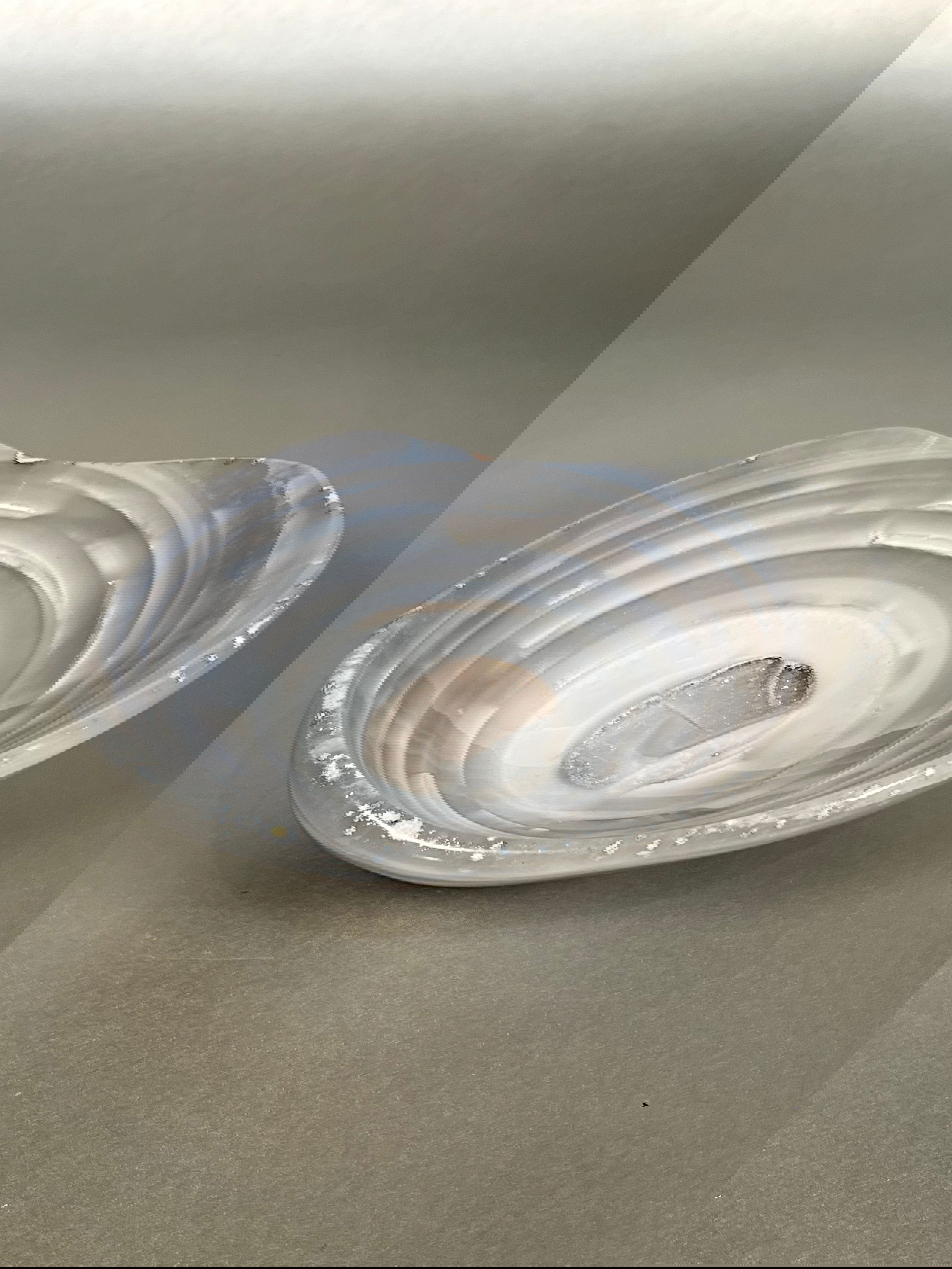 Indulge in the exquisite beauty of our Agate Freeform Bowl. Crafted from stunning multicolored agate, this unique bowl features a freeform design that adds a touch of artistry to any space.Approx. 2.5" x 6.25" Agate Freeform Bowl