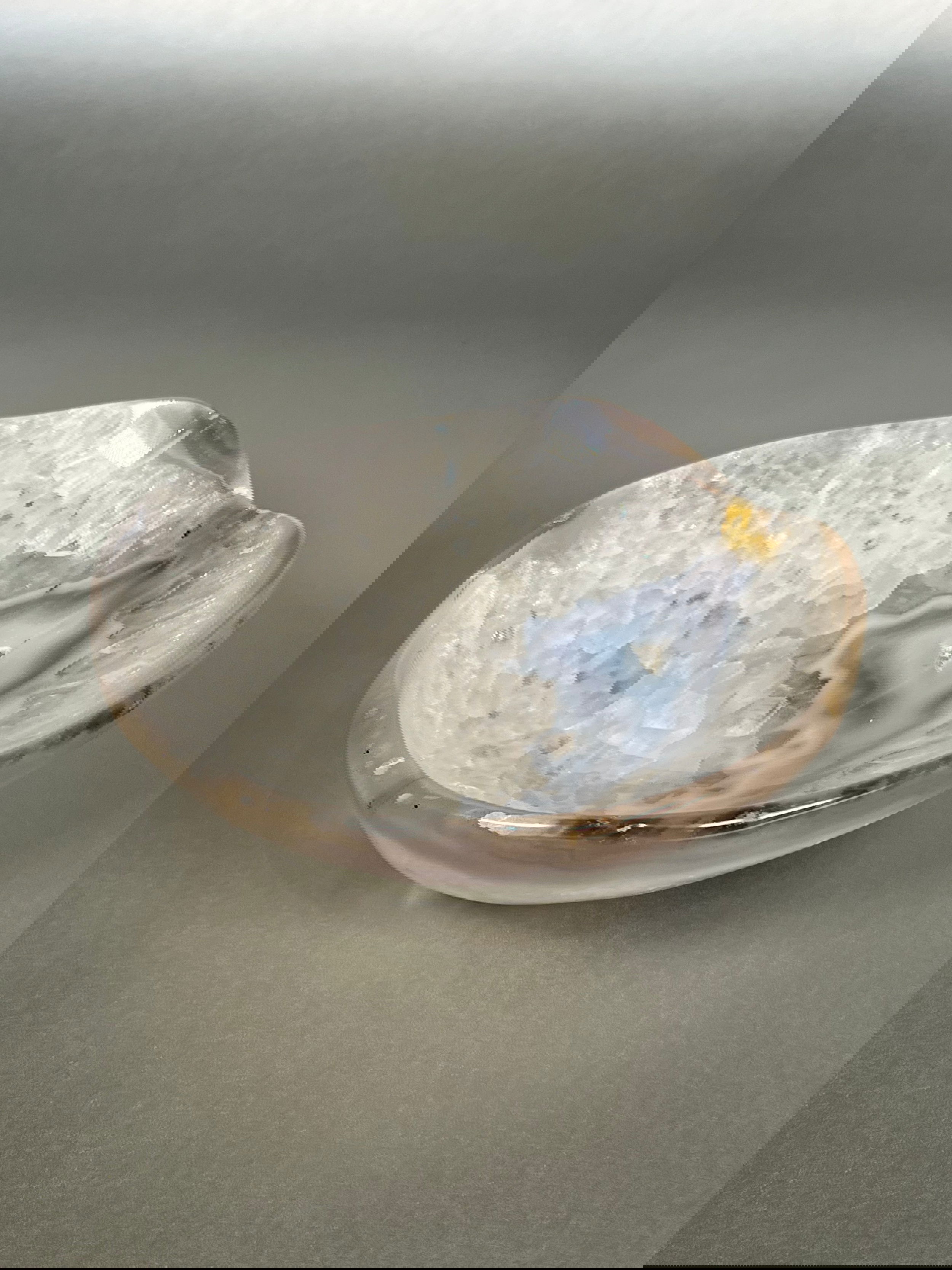Indulge in the exquisite beauty of our Agate Freeform Bowl. Crafted from stunning multicolored agate, this unique bowl features a freeform design that adds a touch of artistry to any space.Approx. 2" x 6" Agate Freeform Bowl