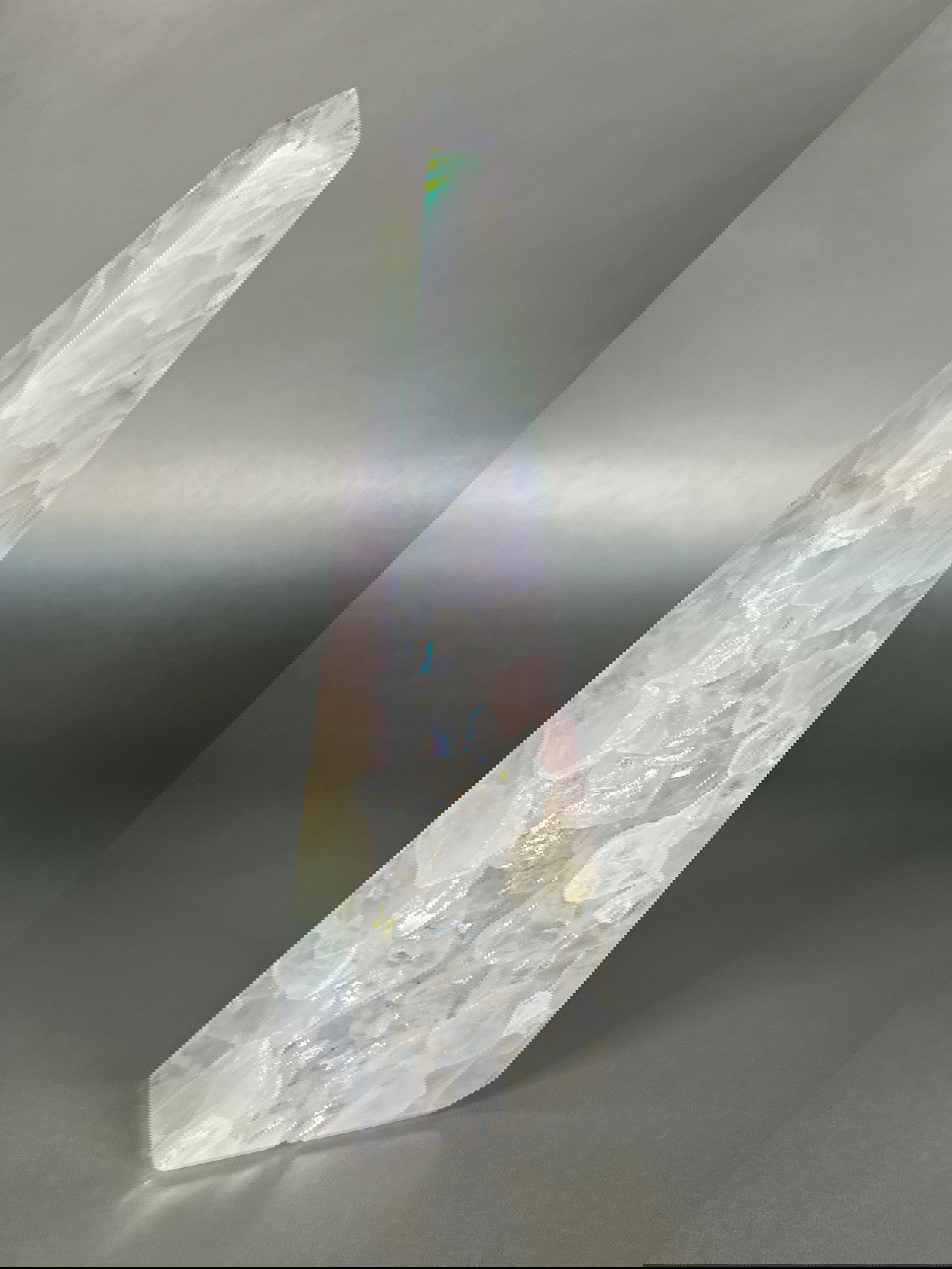 Experience the dreamy elegance of our Aura Agate Obelisk. Each one is uniquely crafted to exude a sense of luxury and exclusivity. Featuring the rare Aura Agate stone, this obelisk brings a touch of sophistication and beauty to any space. Elevate your decor with this truly one-of-a-kind piece.Approx. 8.5" Tall Aura Agate Obelisk