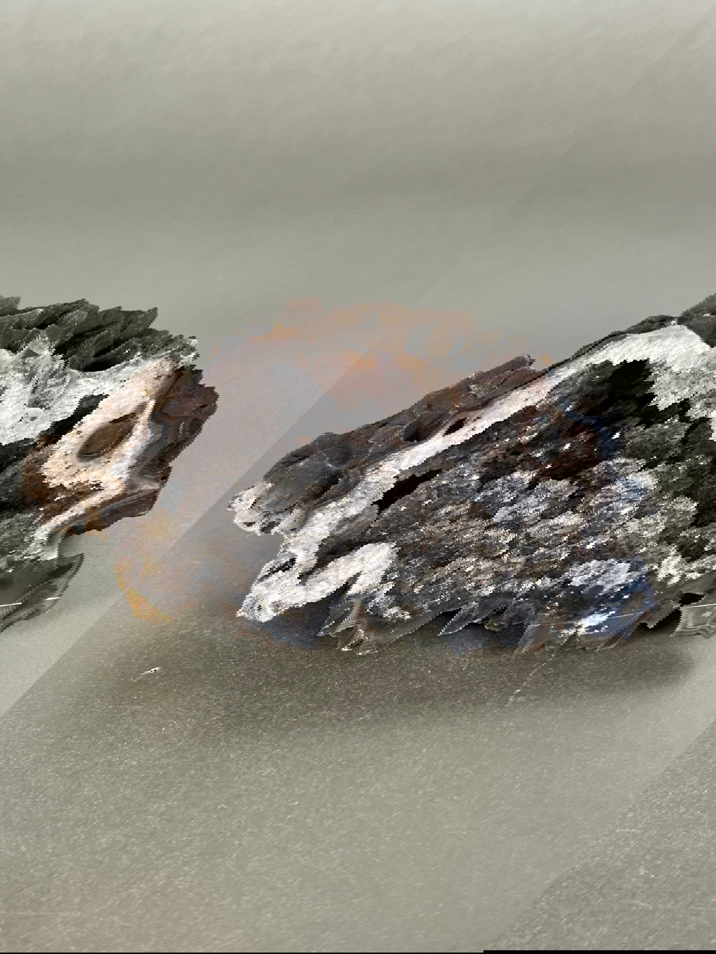 Experience the tranquility of nature with our unique Agate Geodes. These raw pieces are as one-of-a-kind as the natural world itself. Let the serene energy of these stunning agate geodes bring a touch of exclusivity to your decor.Approx. 4" Agate Geode