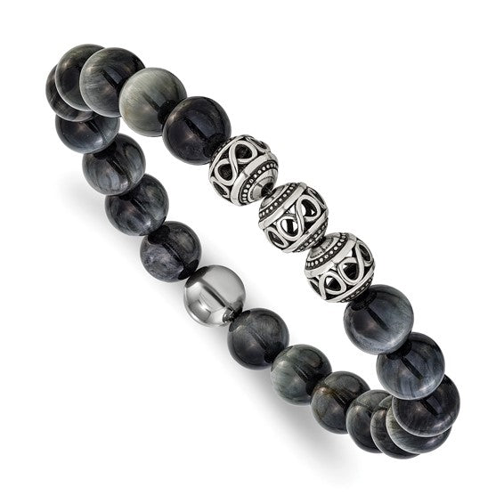Grey Tiger's Eye is known for its grounding and protective energies, often associated with enhancing confidence and balance. Its subtle, muted tones make it versatile, seamlessly complementing both casual outfits and more formal attire. The stretch design ensures a comfortable fit for most wrist sizes, making it an effortless addition to your jewelry collection.-Stainless Steel-Grey Tiger's Eye-Size, 7.75"Item# 39220280 Grey Tiger's Eye Beaded Stretch Bracelet
