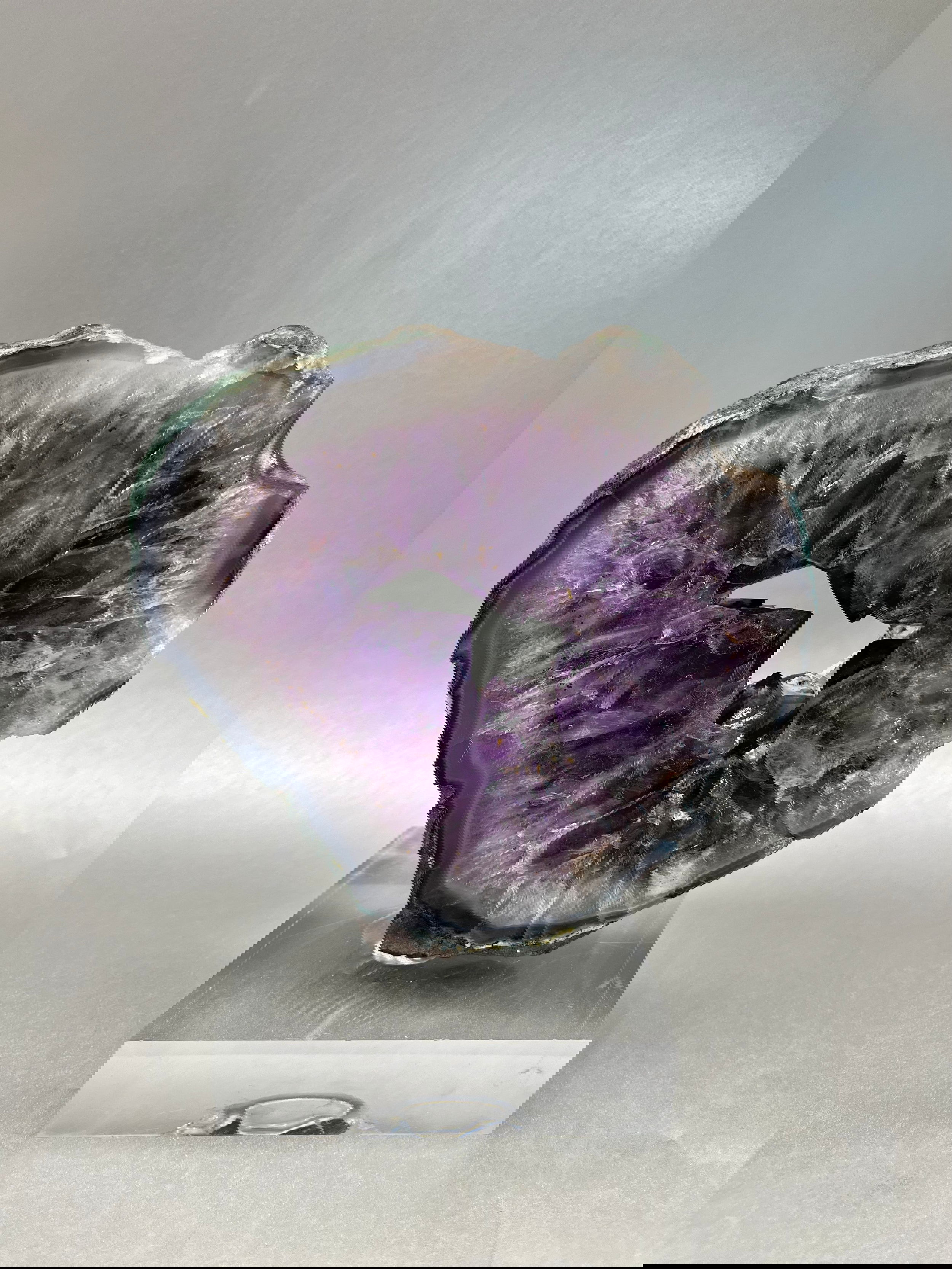 Stunning eye-catching Amethyst ring. Measured at approx. 6" x 6.5". A truly elegant piece for any space. Amethyst Ring On Acrylic