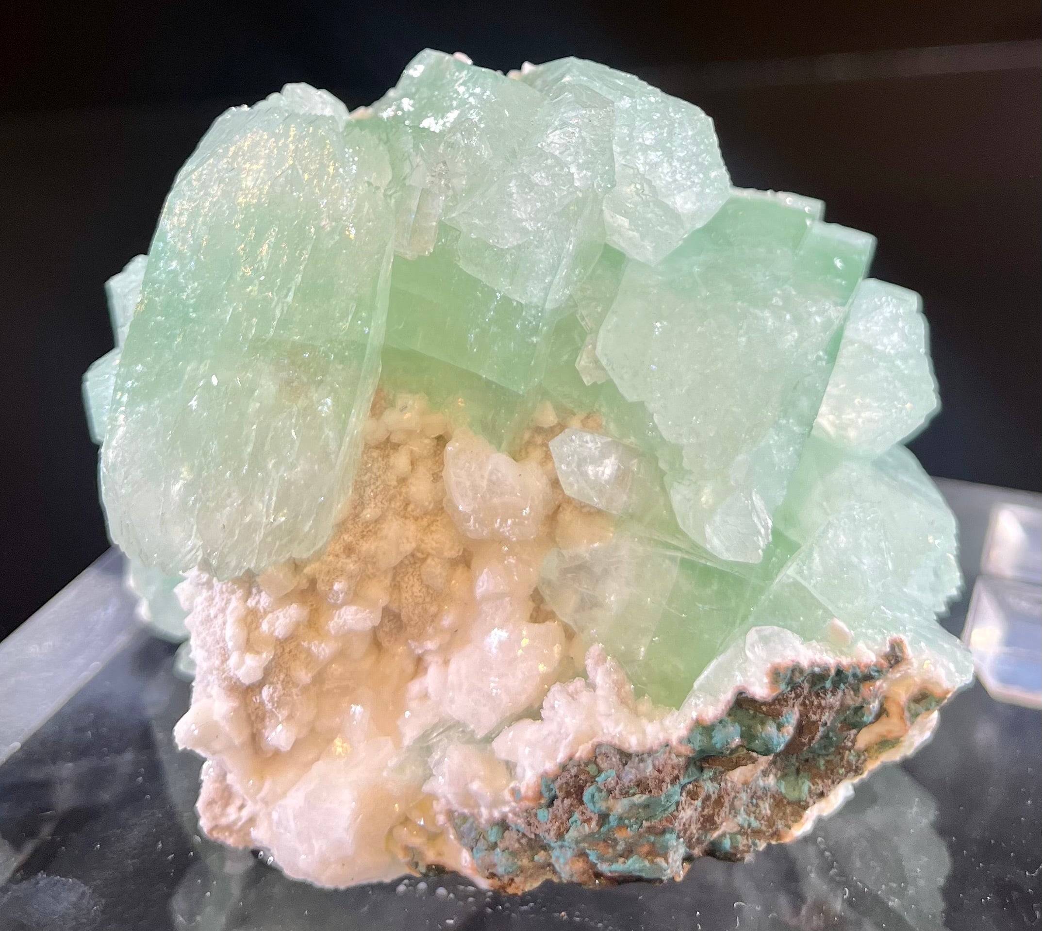 This exquisite specimen of Apophyllite & Heulandite mined at Lonavla, Maharashtra, India is an elegant addition to any collector's display. Its gentle green hue and unique crystalline structure create a subtle yet luxurious effect that is sure to draw the eye. Capture the beauty of the natural world with this refined and exclusive mineral specimen.Approx. 2 1/2"H x 3"W Apophyllite & Heulandite Mineral Specimen