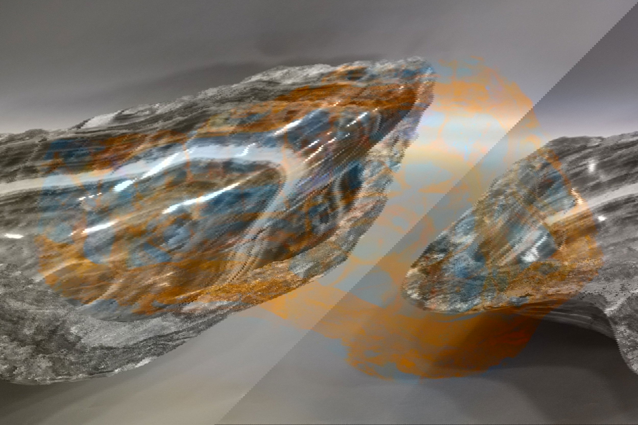 Indulge in luxury with our Blue Onyx Freeform Bowl. Crafted from rich, blue onyx, this freeform bowl features intricate veins for a unique and sophisticated touch. Elevate your decor and add a touch of exclusivity with this stunning piece. Approx. 21.5" x 5" Blue Onyx Freeform Bowl