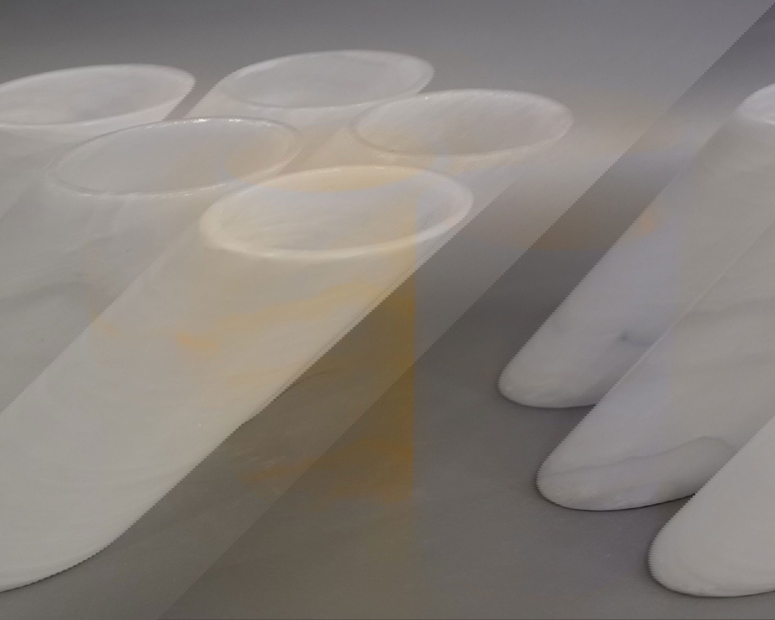 Indulge in the luxurious ambiance of our Cloudy Onyx 10 cm Votive Tumbler. The elegant cloudy onyx material with intricate veining adds a touch of sophistication to any space. Experience the beauty and charm of this premium piece for yourself. Cloudy Onyx 10 cm Votive Tumbler