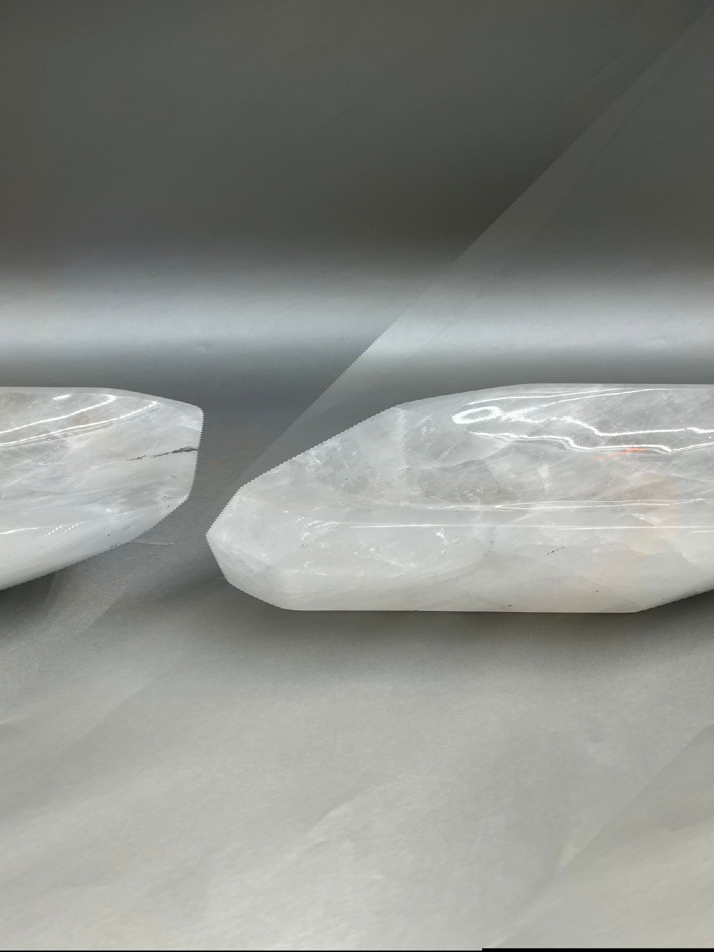 This Crystal Quartz Dish is meticulously polished to near perfection, making it a luxurious and exclusive find. Its shimmering surface radiates comforting vibes, making it an alluring addition for any living space. 10" x 6". Crystal Quartz Dish