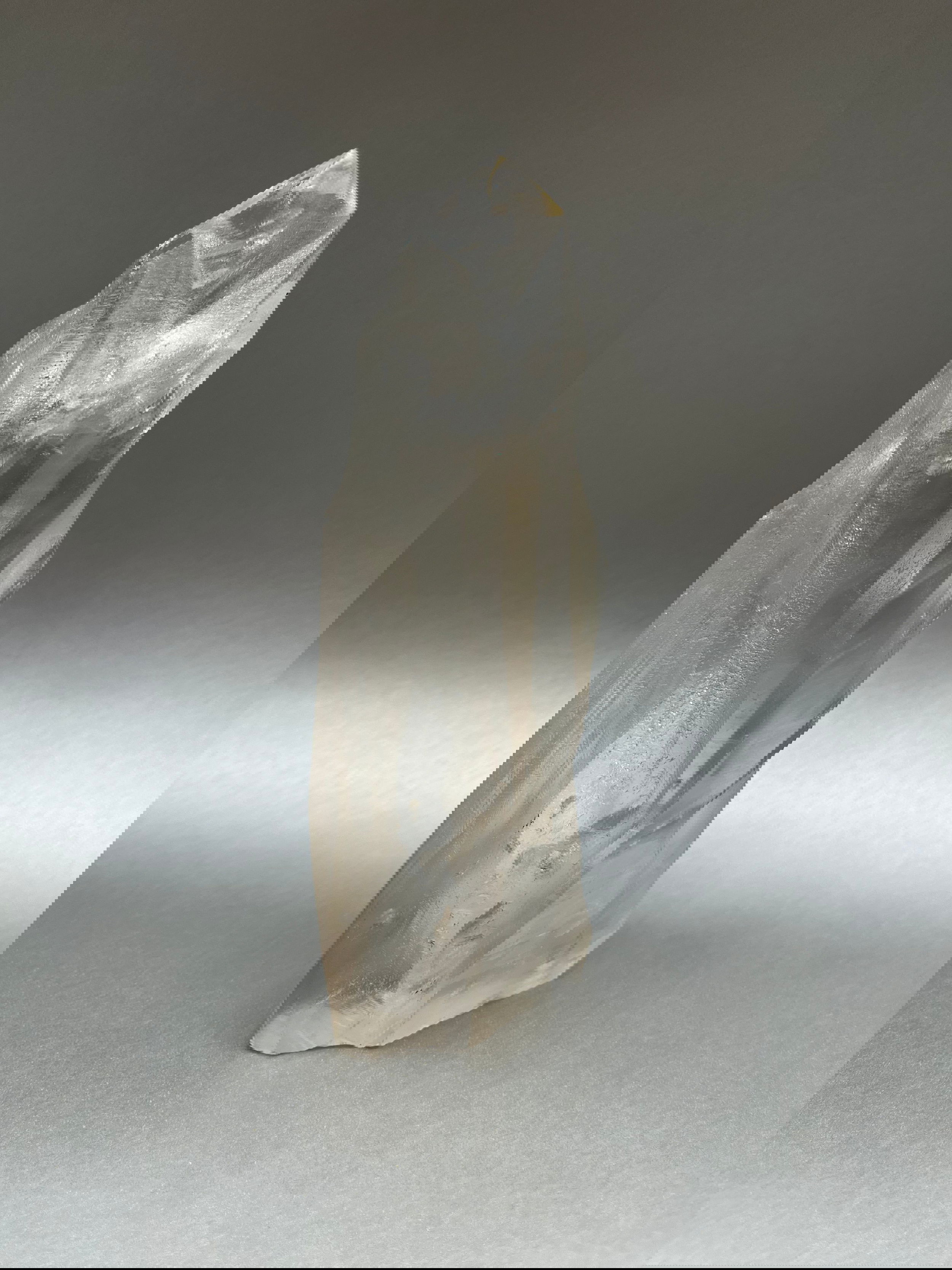 Luxuriate in the glittering beauty of Clear Ice Quartz Points, with their unique, twisted shapes crafted by nature's artistry. 7.5" x 3". Clear Ice Quartz Obelisk