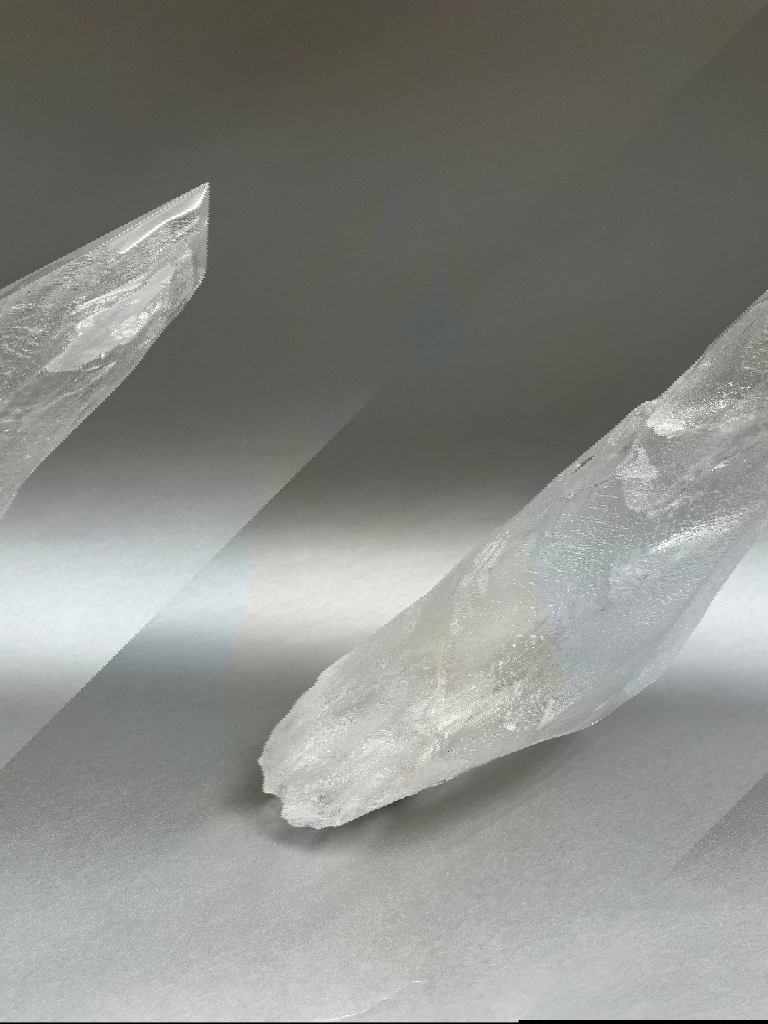 Luxuriate in the glittering beauty of Clear Ice Quartz Points, with their unique, twisted shapes crafted by nature's artistry. 7.5" x 4.5". Clear Ice Quartz Obelisk