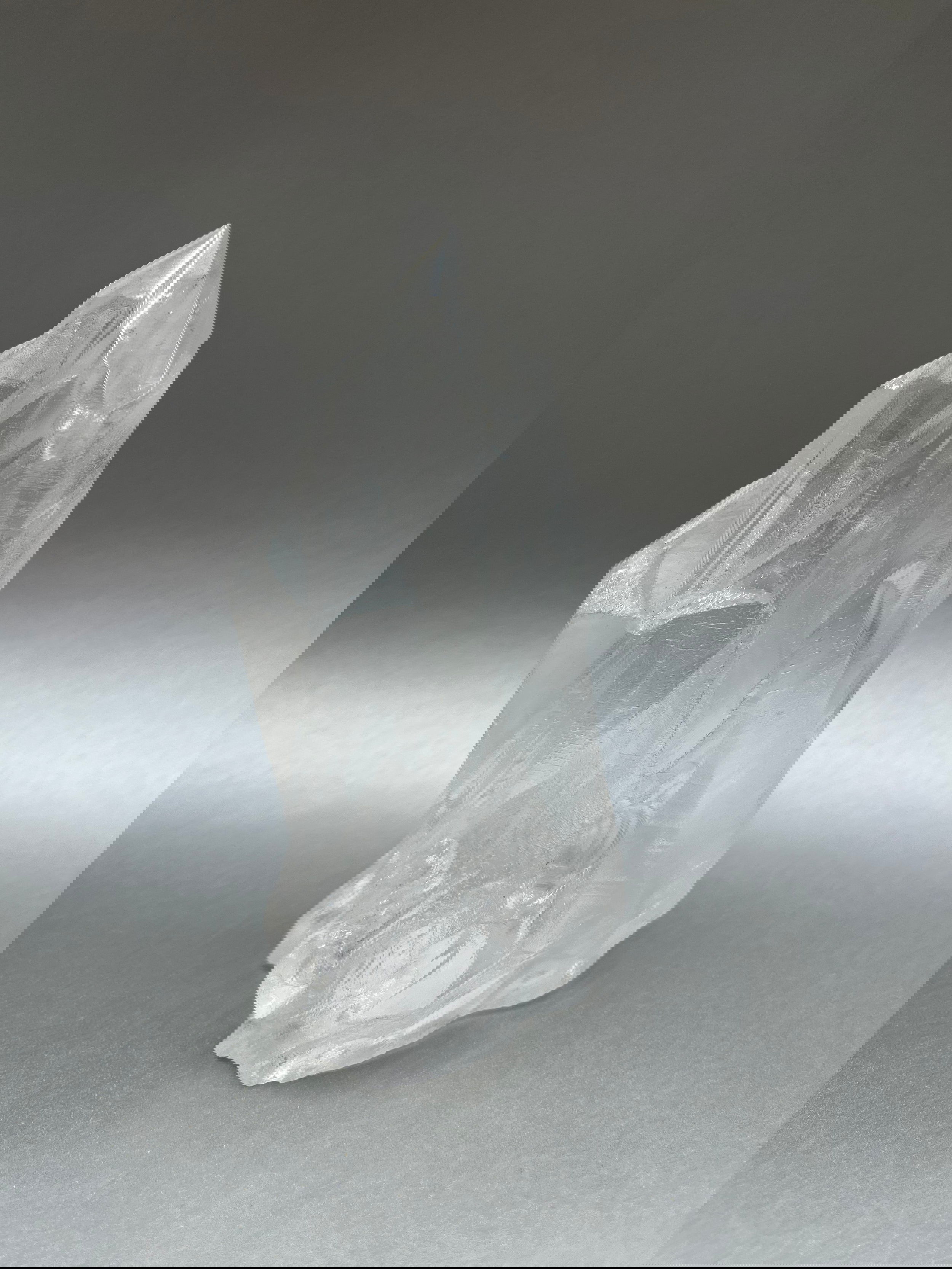 Luxuriate in the glittering beauty of Clear Ice Quartz Points, with their unique, twisted shapes crafted by nature's artistry. 6.5" x 3". Clear Ice Quartz Obelisk