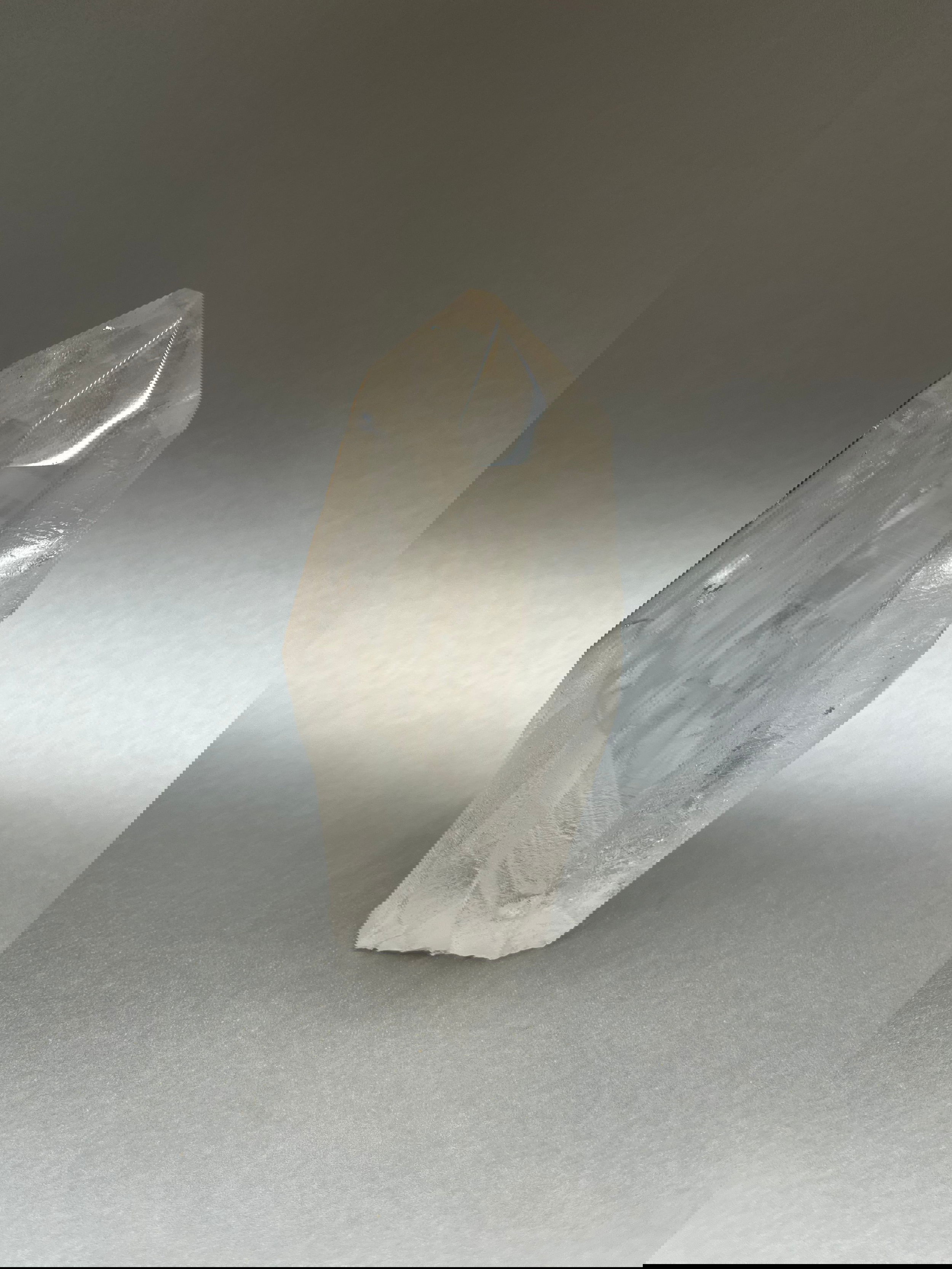 Luxuriate in the glittering beauty of Clear Ice Quartz Points, with their unique, twisted shapes crafted by nature's artistry. 4" x 2.5". Clear Ice Quartz Obelisk