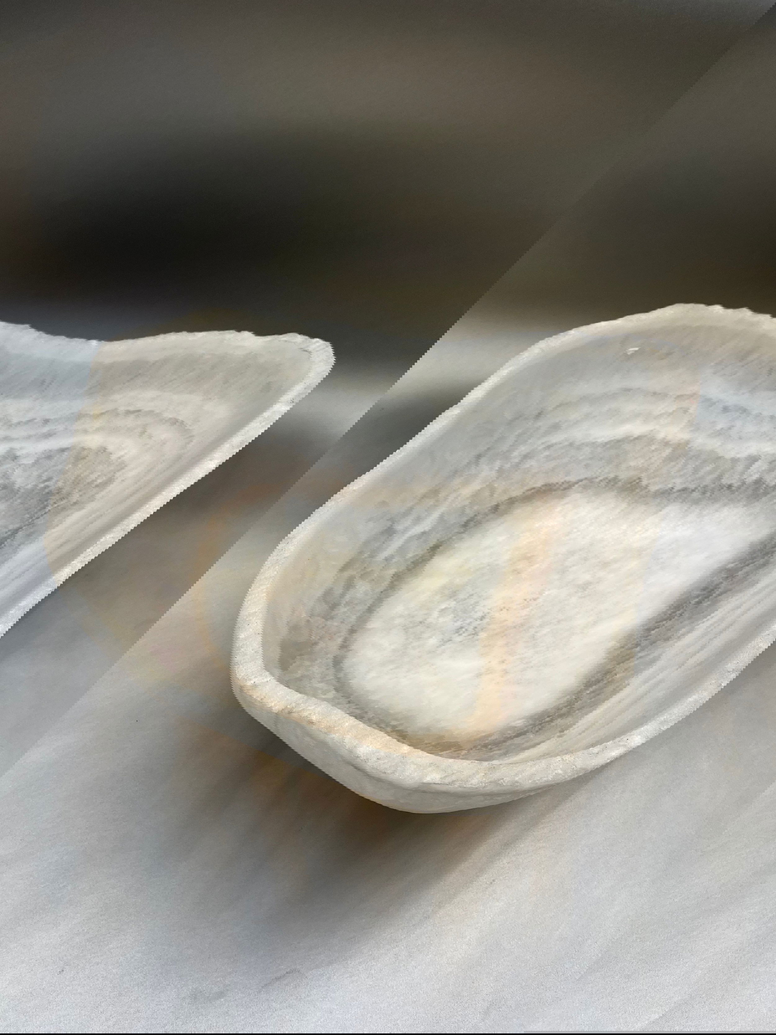Enveloping its contents in a medium-sized embrace, this Ice Onyx Bowl commands attention at 15"x15"x7". Ice Onyx Bowl
