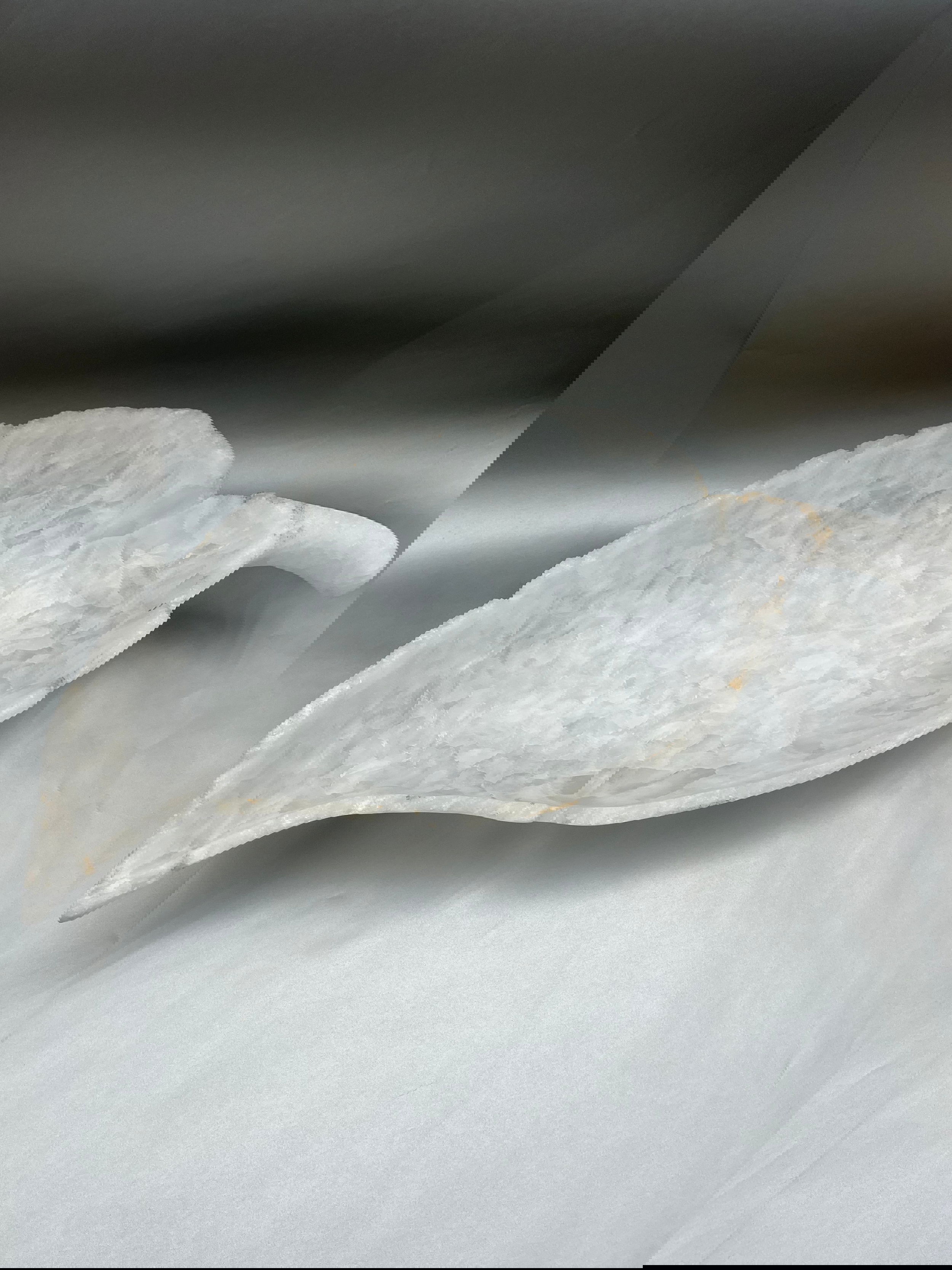 This exquisite Ice Onyx Leaf Bowl stands at 14"x28"x6", expertly handcrafted and carved to an intricate, leaf-shaped design. Ice Onyx Leaf Bowl