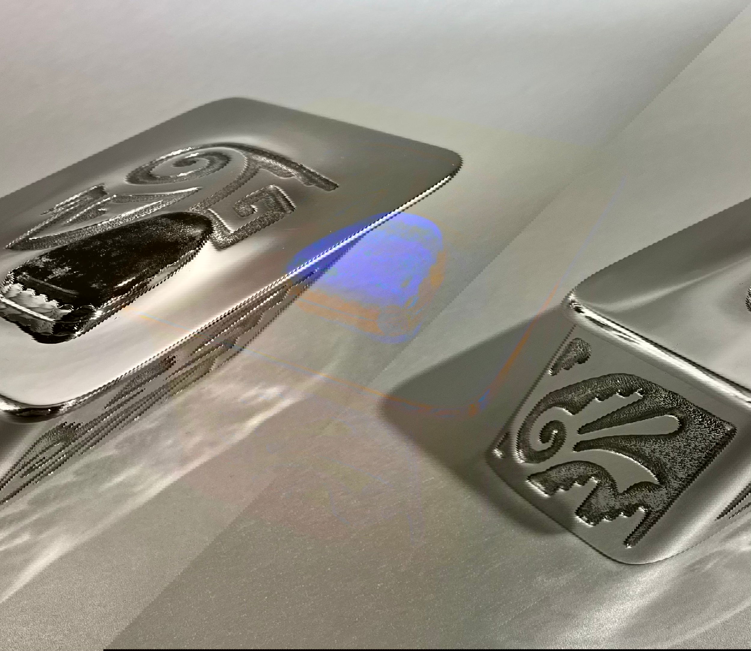 This Nickel Silver Treasure Box features an intricately-designed acid-etched lid adorned with a Lapis gemstone and is soldered and hand-forged for durability. The interior is also lined with quality leather. Approx. 3.5" x 3.5". Nickel Silver Treasure Box w/ Lapis