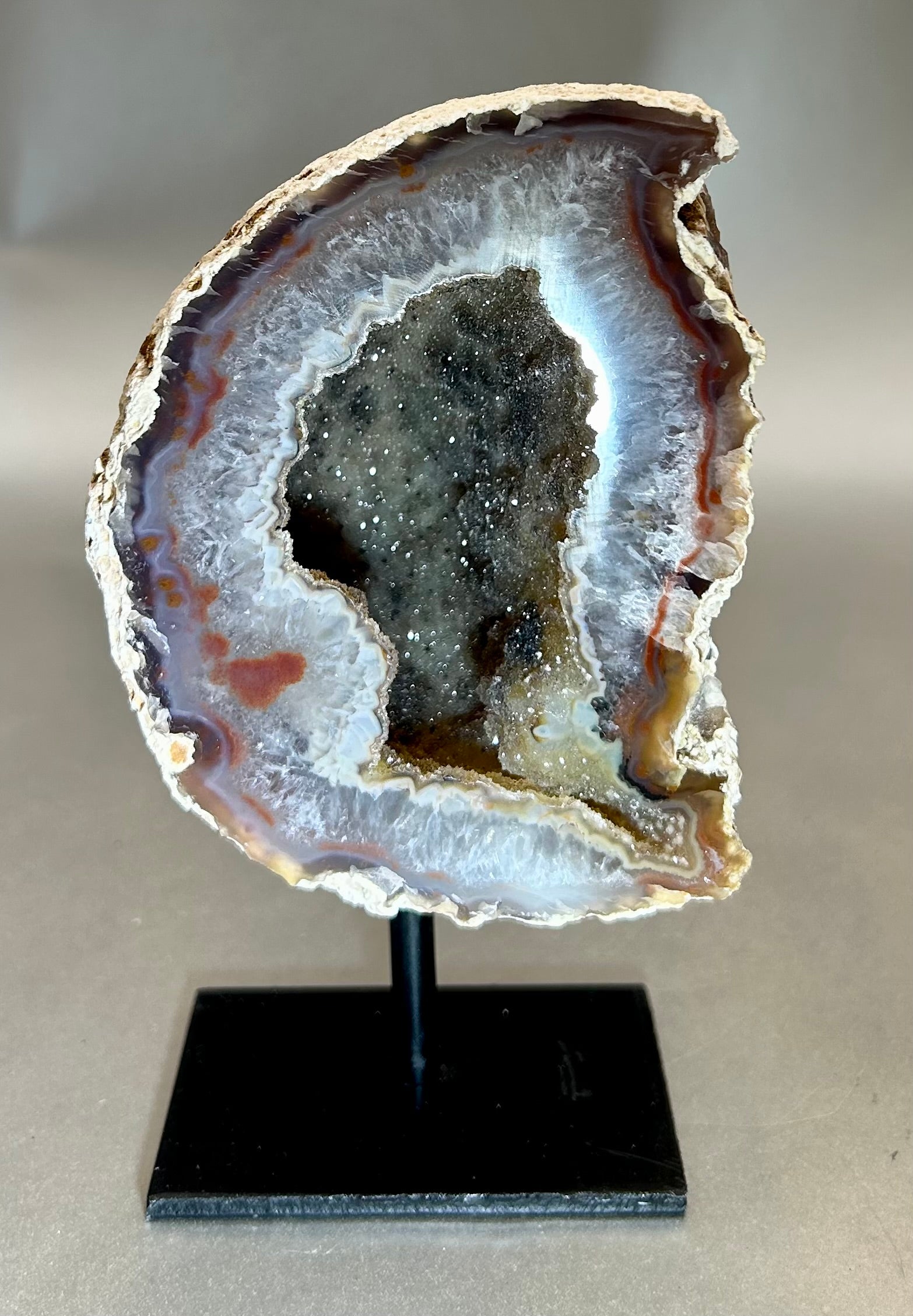 Alluring Druzy Agate Geode set on metal stand. Approx. 3.25" x 4" with out standApprox. 3.25" x 5.5" with stand Druzy Agate on Metal Stand