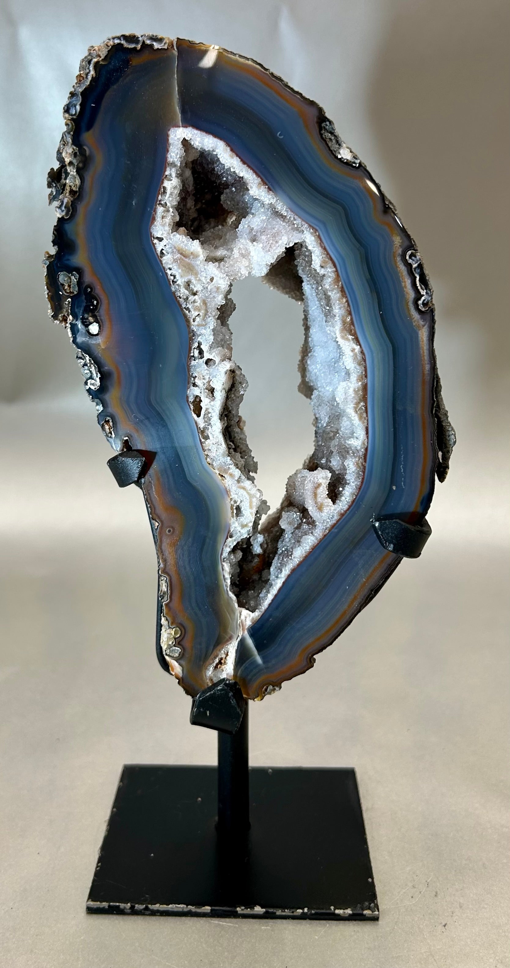 Alluring Druzy Agate Geode set on metal stand. Approx. 4" x 7.25" with out standApprox. 4" x 9.25" with stand Druzy Agate on Metal Stand