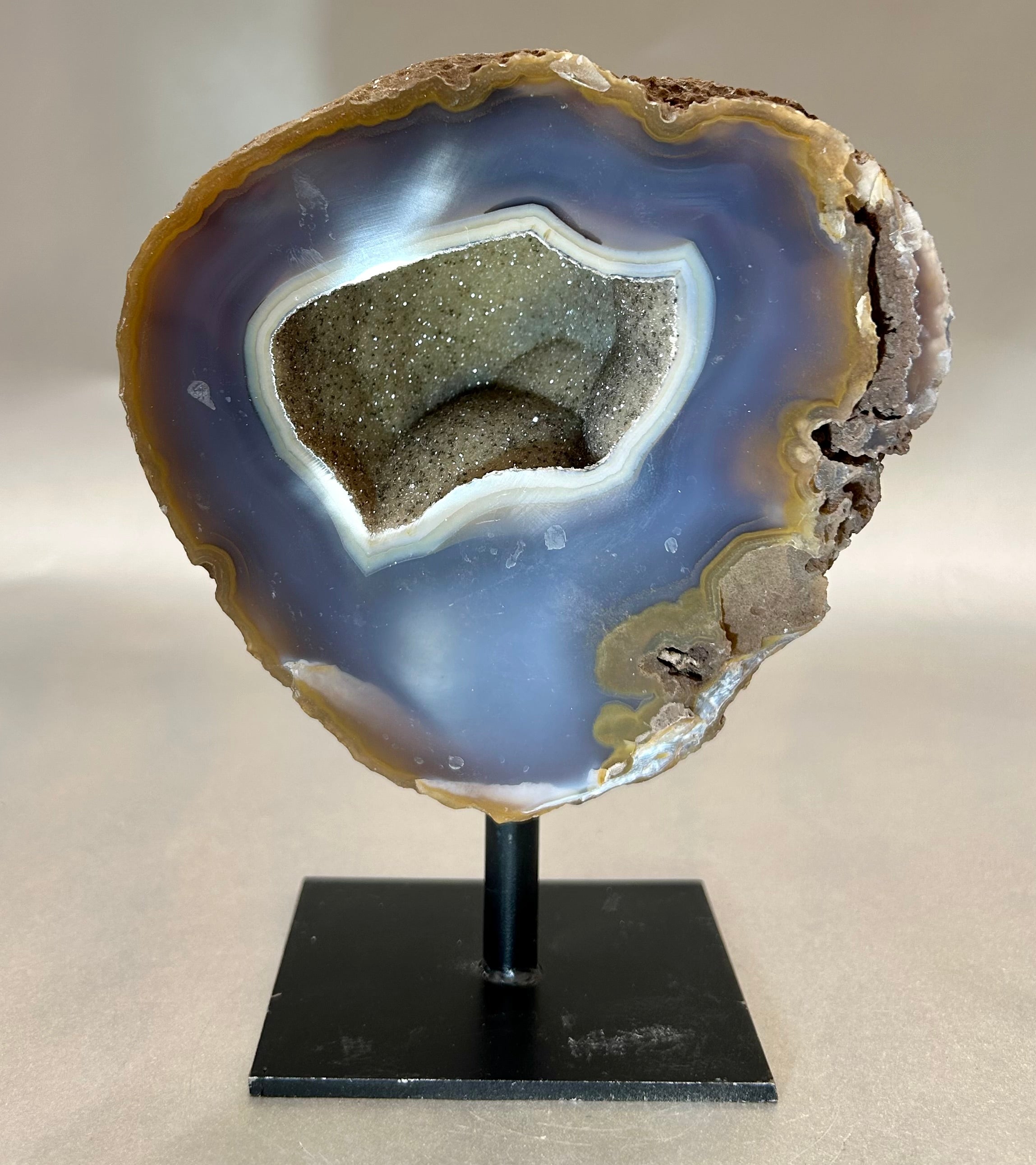 Alluring Druzy Agate Geode set on metal stand. Approx. 4.75" x 4.75" with out standApprox. 4.75" x 6" with stand Druzy Agate on Metal Stand