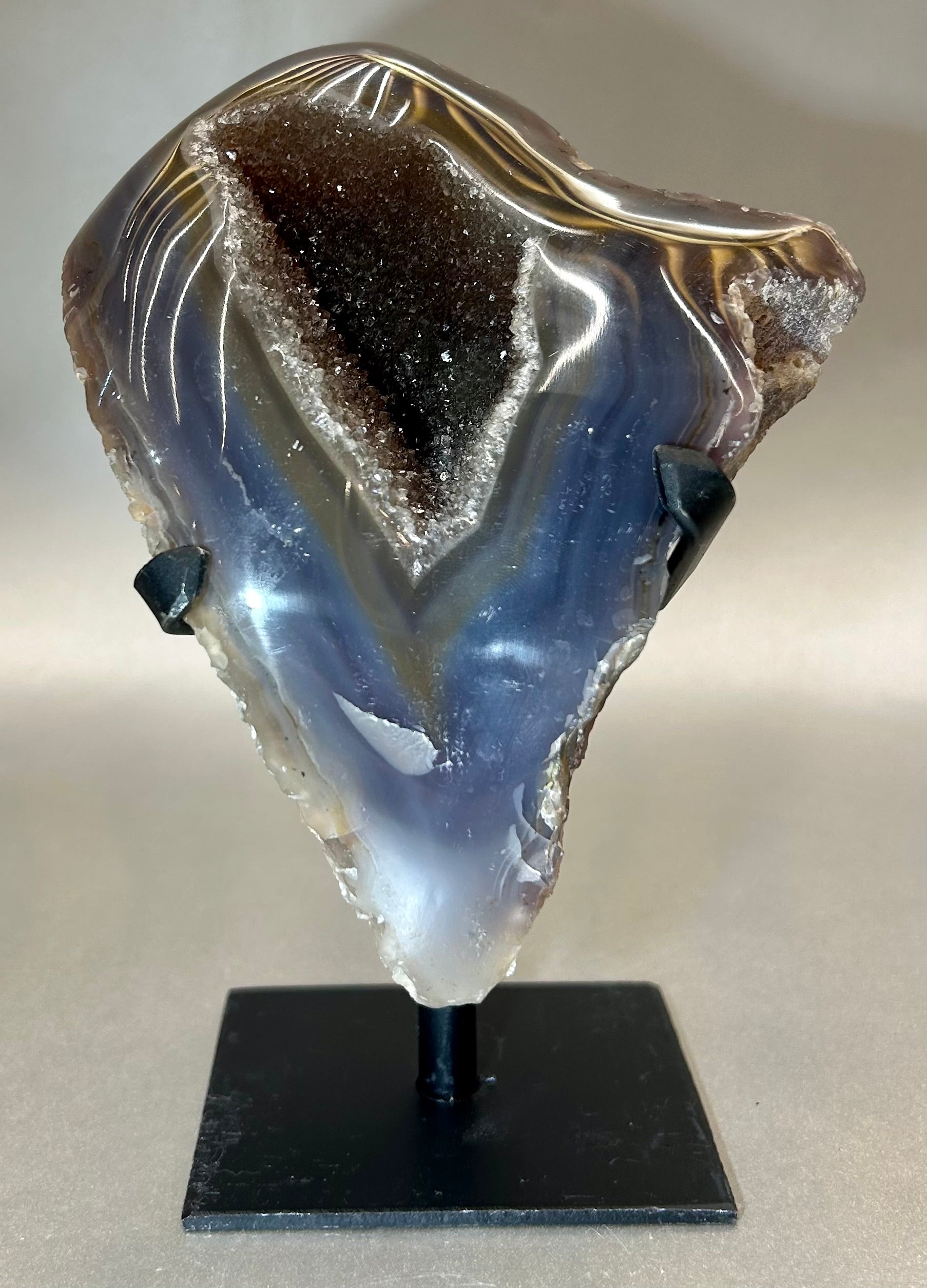 Alluring Druzy Agate Geode set on metal stand. Approx. 4.5" x 5.5" with out standApprox. 4.5" x 7" with stand. Druzy Agate on Metal Stand