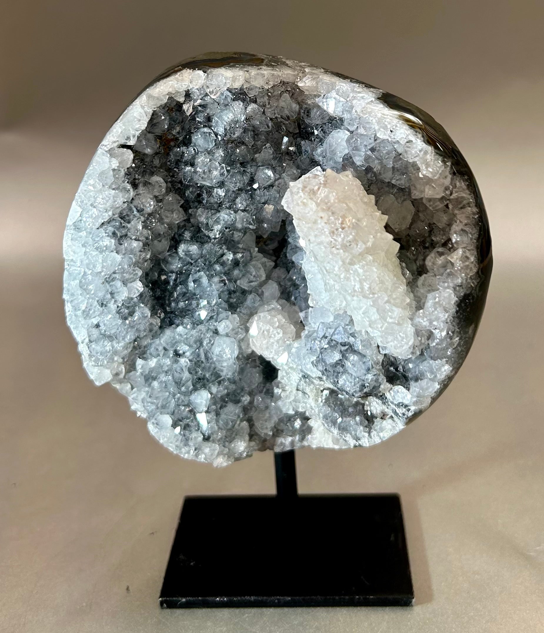 Alluring Druzy Agate Geode set on metal stand. Approx. 4" x 4.5" with out standApprox. 4" x 6" with stand. Druzy Agate on Metal Stand