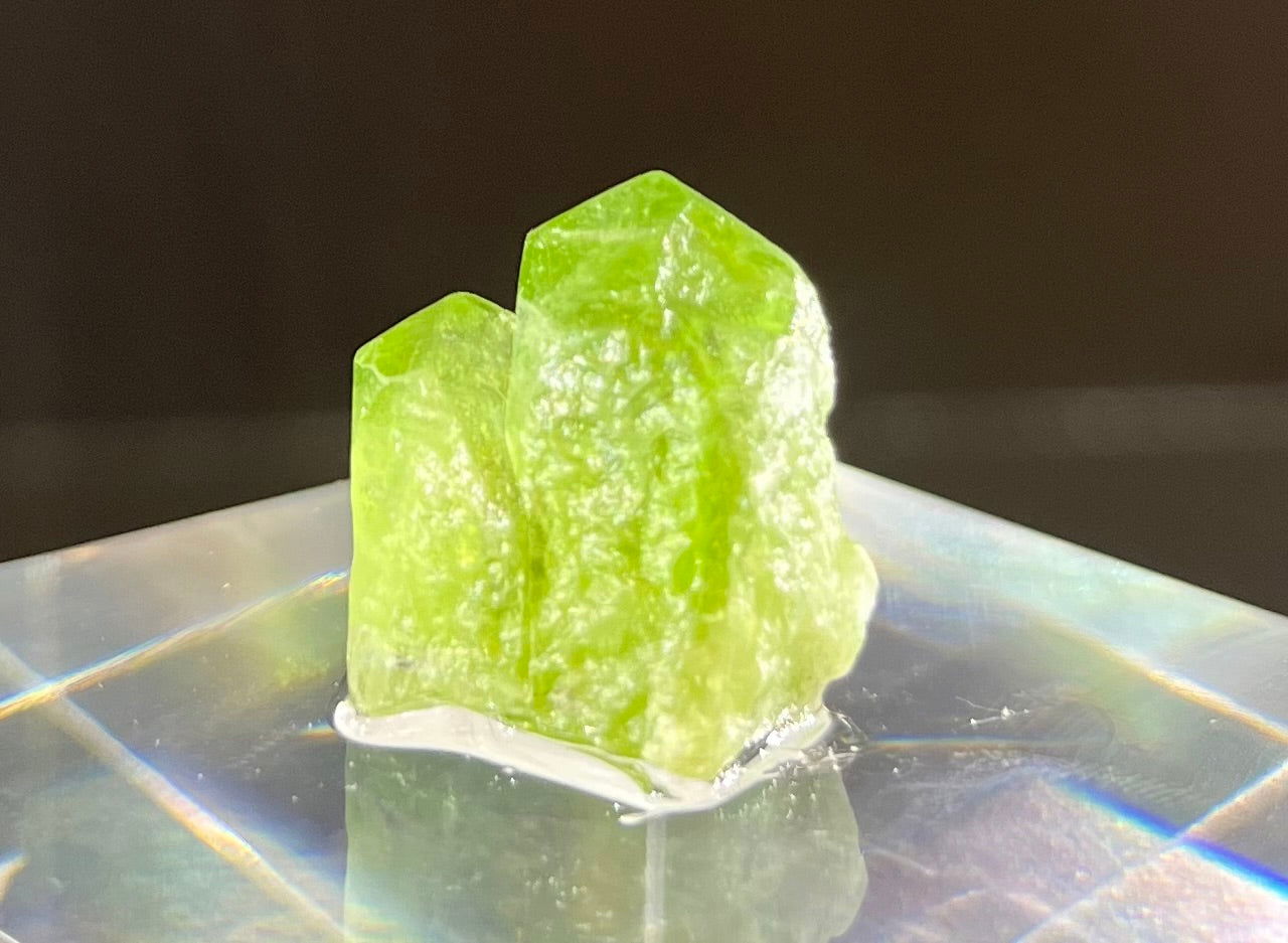 This Peridot is sourced from the breathtaking region of the Kaghan Valley in Pakistan, giving it an unparalleled quality and sparkle. Every piece is hand-mined and polished with craftsmanship and care, ensuring an unparalleled level of luxury and exclusivity. Give your look a hint of elegance with our unique Peridot stones.Region- Sapat, Kaghan Valley, Khyber Pakhtunkhwa Province, PakistanApprox. 7/8"H x 3/4"W Peridot Mineral Specimen