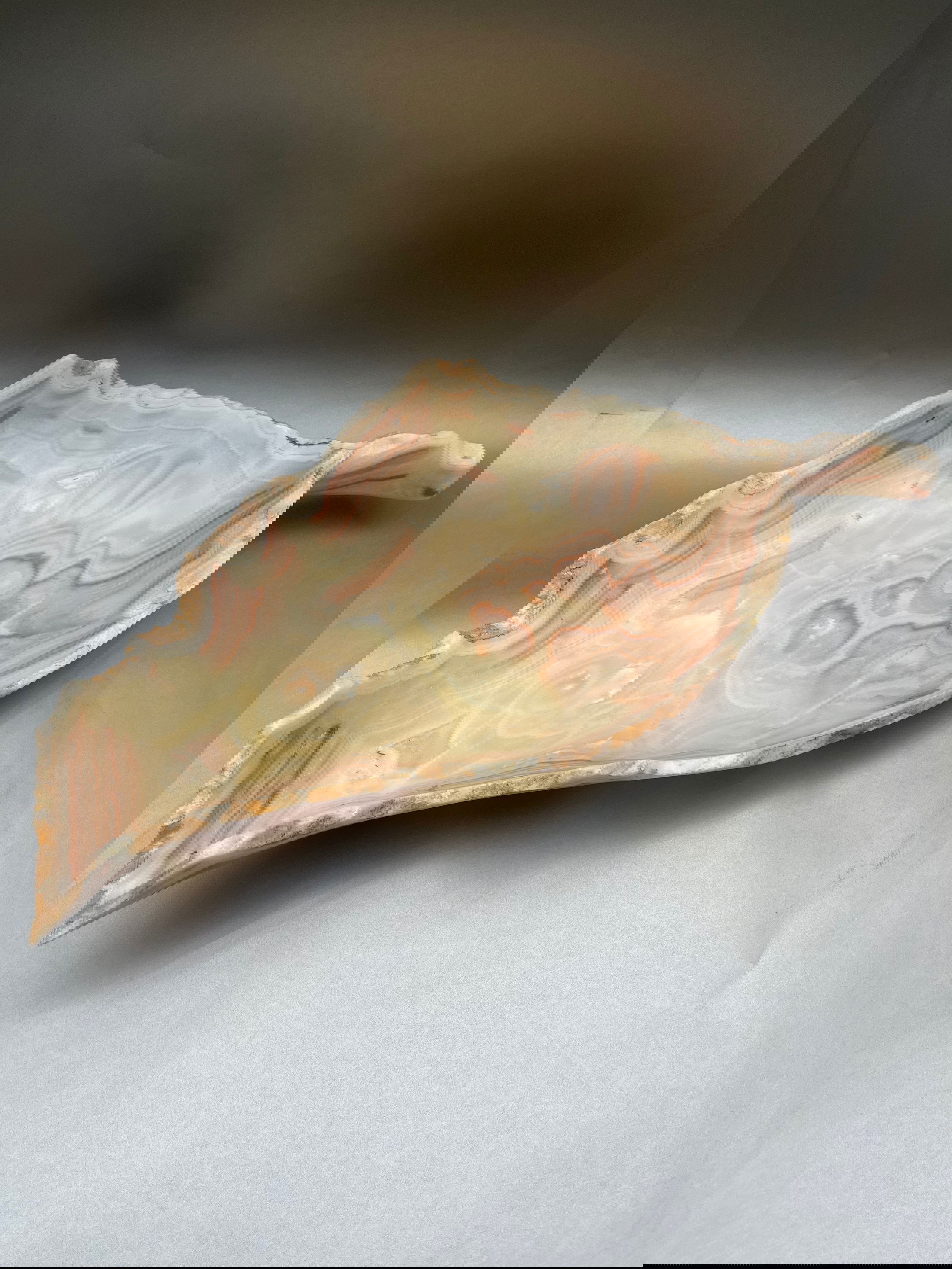 This exquisite Onyx Leaf Bowl stands at 11"x23"x4" with its intricate shape and finish making it a luxurious and tasteful addition to any interior decor. Onyx Pink Leaf Bowl
