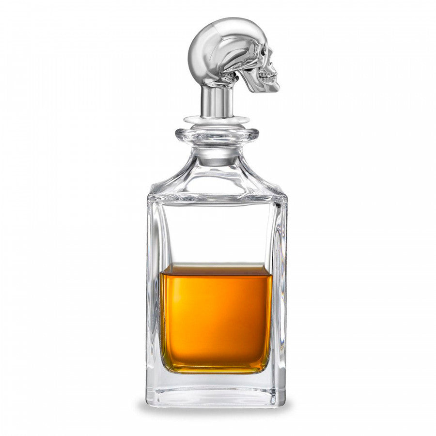 Our beautiful crystal glass decanters are extra special. Manufactured in a traditional square spirit style by Dartington. Once the decanters are delivered to Deakin & Francis, we pair with one of our stunning stoppers which are designed in our factory, in Birmingham’s historic Jewellery Quarter. This crystal skull decanter holds 65cl.This skull decanter is finished with a stunning, metal plated skull head stopper, designed and manufactured by Deakin & Francis. Featuring the iconic Deakin & Francis jaw dropping, eye popping movement, the skull reveals cultured ruby red eyes as the jaw drops. This skull whiskey decanter is sure to be the centre of attention at any party or get together. Polished Skull Head Crystal Decanter