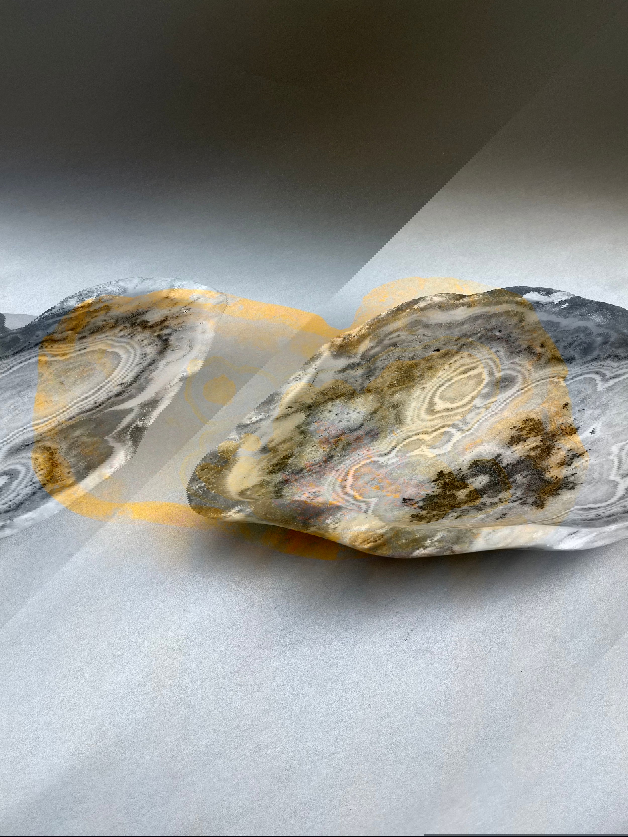 A Stunning Seafoam Bowl measuring 11" x 5" adds a touch of elegance to any place. Indulge in the luxurious elegance of our Seafoam dish. Made from unique seafoam onyx, this stunning decor piece adds a touch of sophistication to any room. Use it as a bowl for a truly unique and exclusive statement. Elevate your space with our Seafoam dish. Seafoam Onyx Bowl