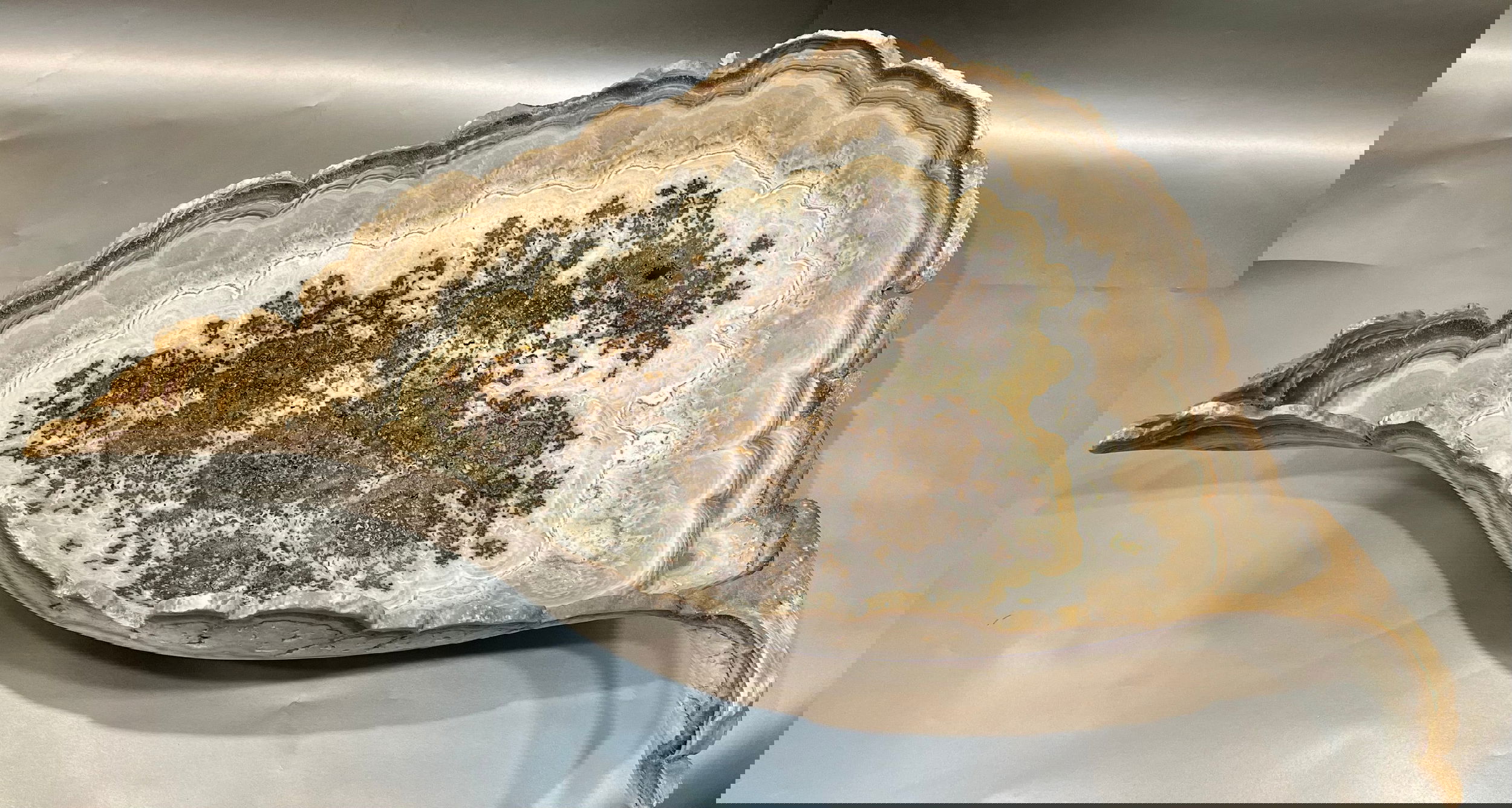 Stalagmite Leaf Bowl approx. 35.5" x 18.5".Introducing our Stalagmite Leaf Bowl, crafted from natural cave stalagmite, hand-carved into a delicate leaf shape. Each bowl is unique, representing nature's artistry and bringing an exclusive touch to your home decor. Elevate your space with this luxurious and one-of-a-kind piece.Measures approx. 35.5" x 18.5". Stalagmite Leaf Bowl