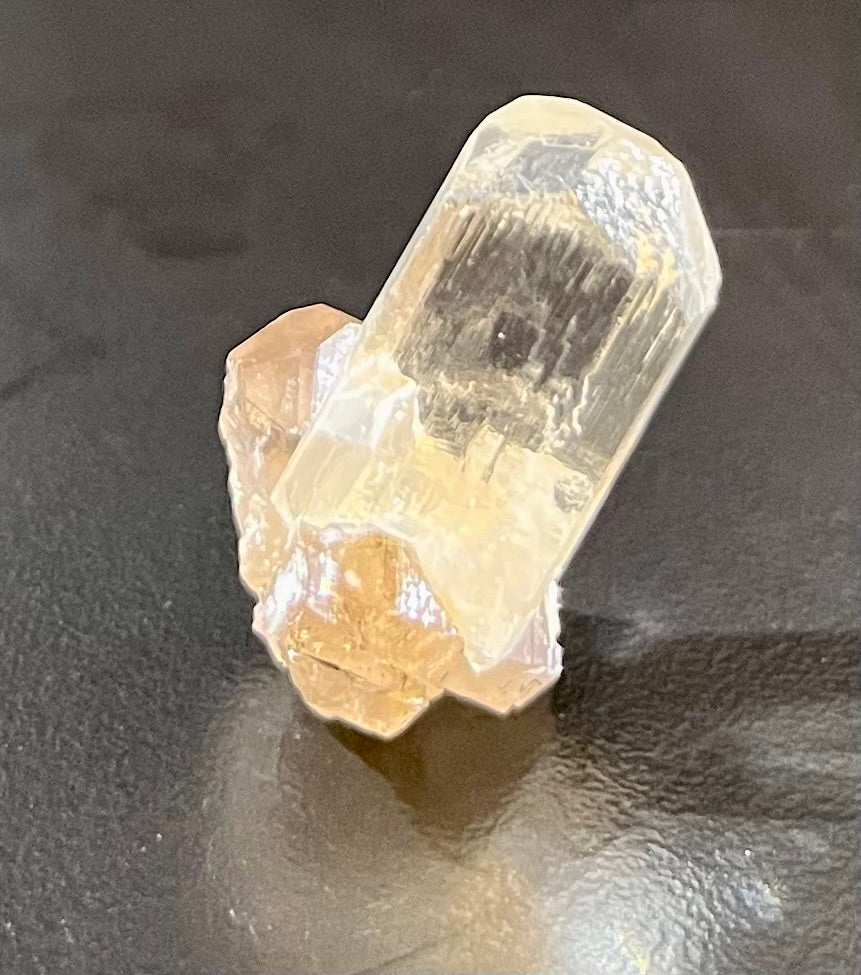 This stunning specimen of Topaz with Smoky Quartz has been mined from the Doi Tai Mine in Vietnam's Thanh Hoa Province. Its vibrant colors and unique shapes make it a valuable collector's item, perfect for displaying and appreciation. 0.2 lbs.Approx. 15/16"H x 3/4"W Topaz with Smoky Quartz Mineral Specimen