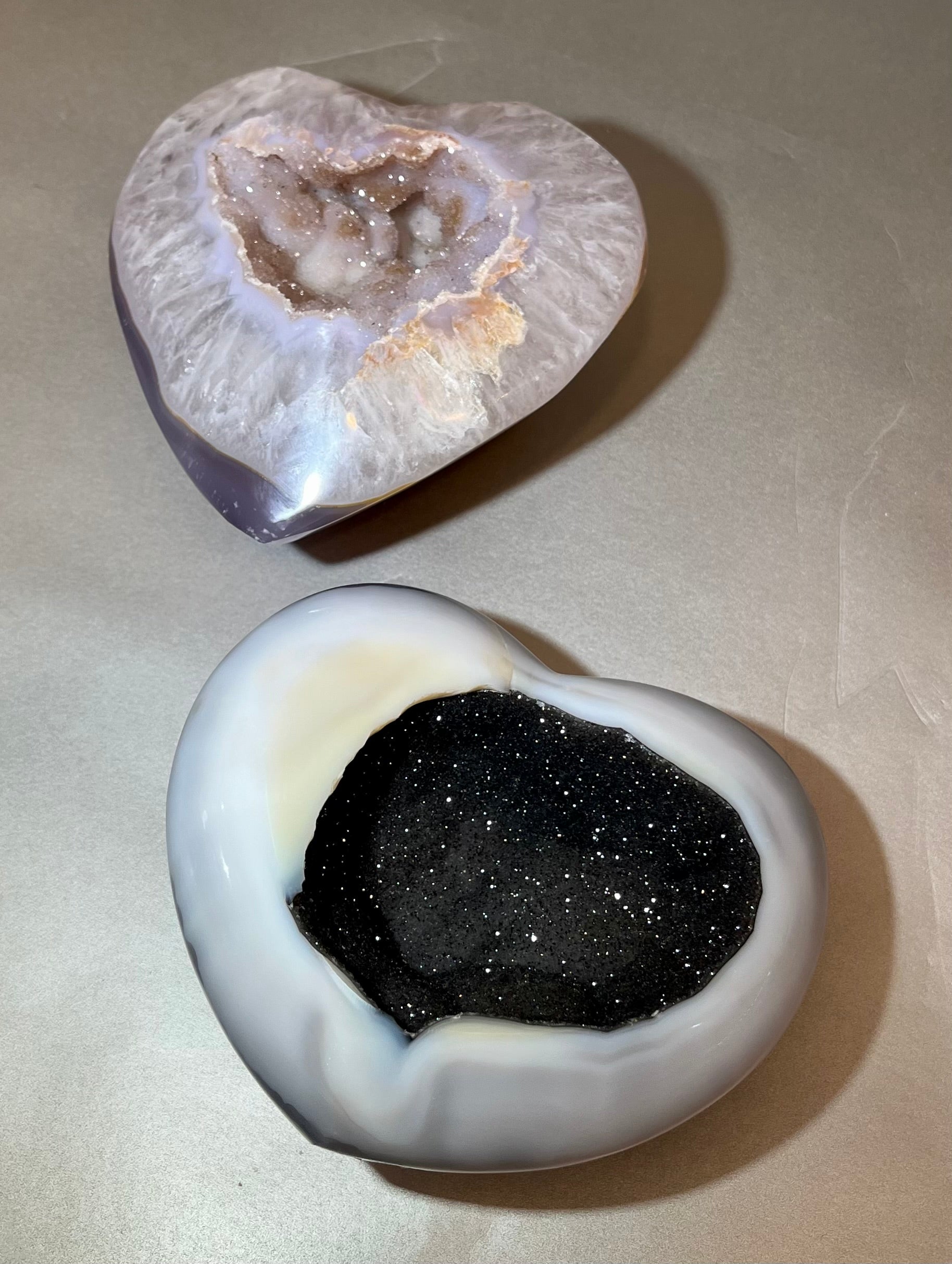 These extra large size Druze crystals are beautiful gemstones, each with the unique shape of a heart. The Druze variety usually has a distinct crystalline surface with tiny sparkling crystals embedded within. These are lovely little minerals that would make a wonderful gift or addition to your personal collection. Style and color will vary per stone in your order. Druse Heart- Extra Large