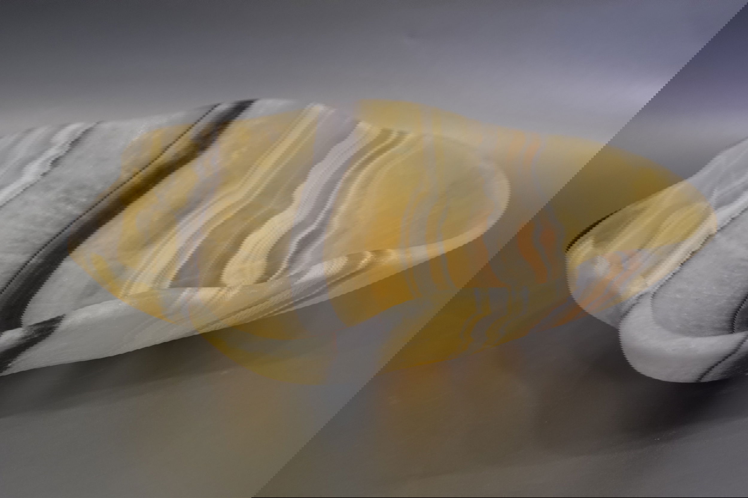 Indulge in the luxurious uniqueness of our Zebra Onyx Bowl. Its banded surface showcases the exquisite patterns of zebra onyx, while its distinct shape adds a touch of sophistication. Elevate your home decor with this exclusive piece that exudes elegance and refinement.Approx. 12" x 3" Zebra Onyx Bowl
