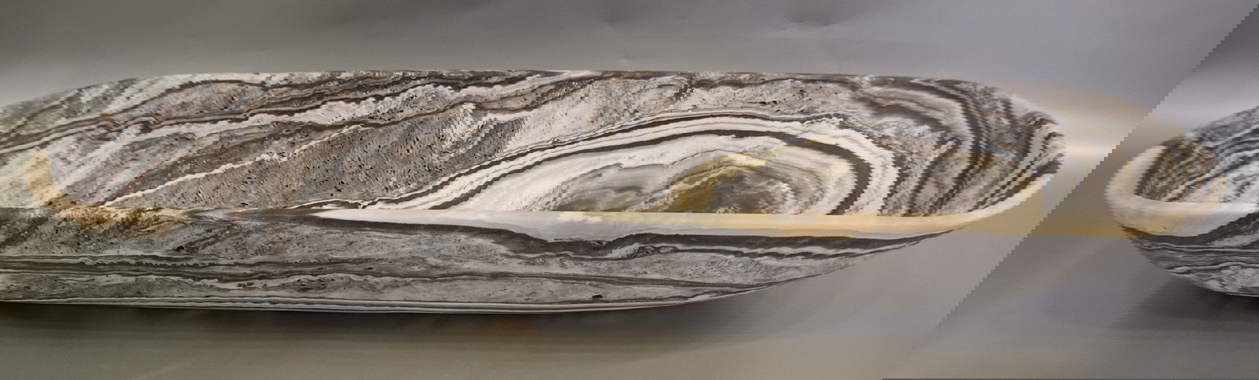 The Zebra Onyx Matte Trough is a luxurious addition to any space. Its stunning zebra onyx veining, combined with a sleek matte finish, creates a one-of-a-kind piece. This trough exudes exclusivity and elegance. Elevate your decor with this sophisticated and unique product.Approx. 35" x 10" x 5.25" Zebra Onyx Trough